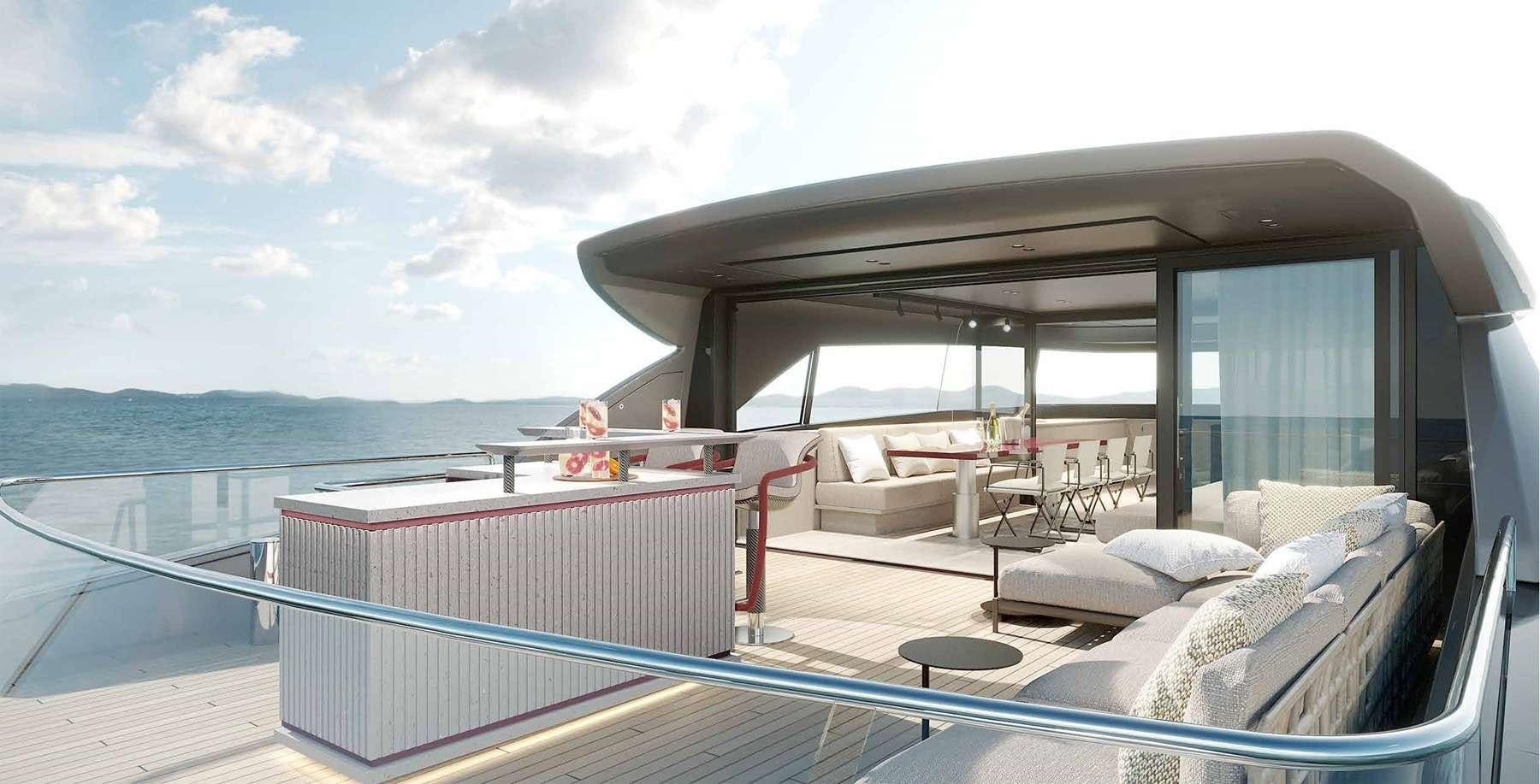a large deck with a view of the ocean and the ocean aboard SENSA Yacht for Charter