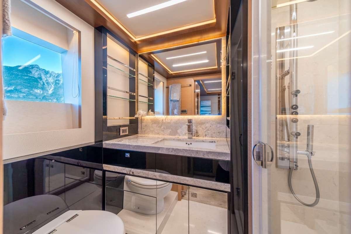 a bathroom with a large mirror aboard VOYAGER Yacht for Charter