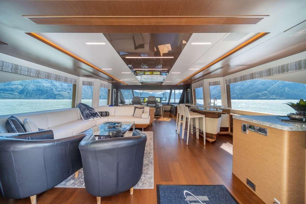 a room with a couch and a table aboard VOYAGER Yacht for Charter