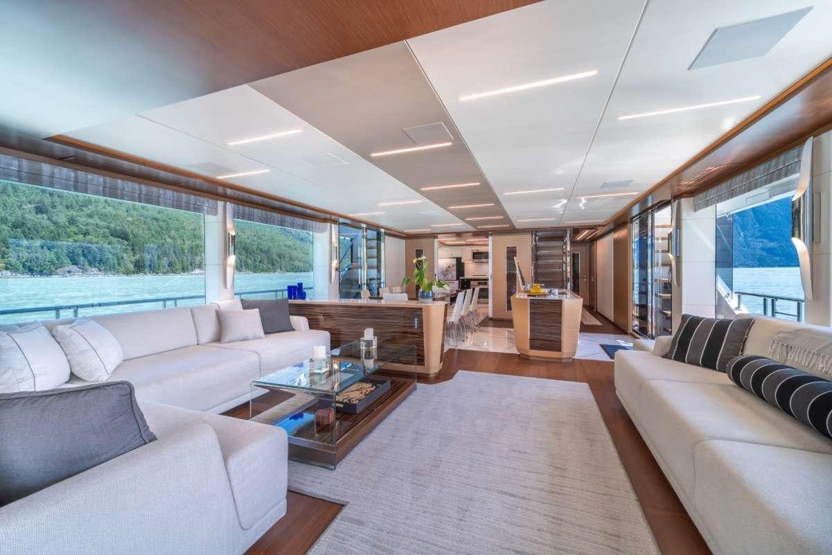 a living room with a large window aboard VOYAGER Yacht for Charter