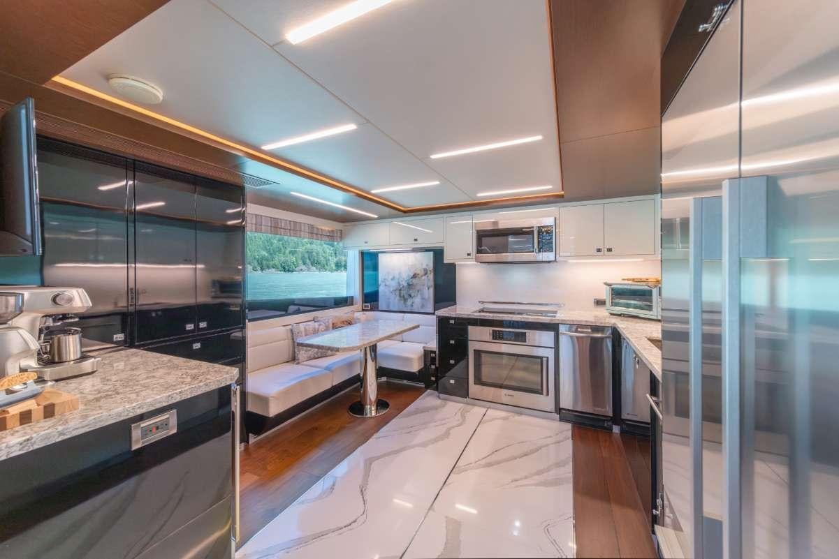 a kitchen with a large island aboard VOYAGER Yacht for Charter