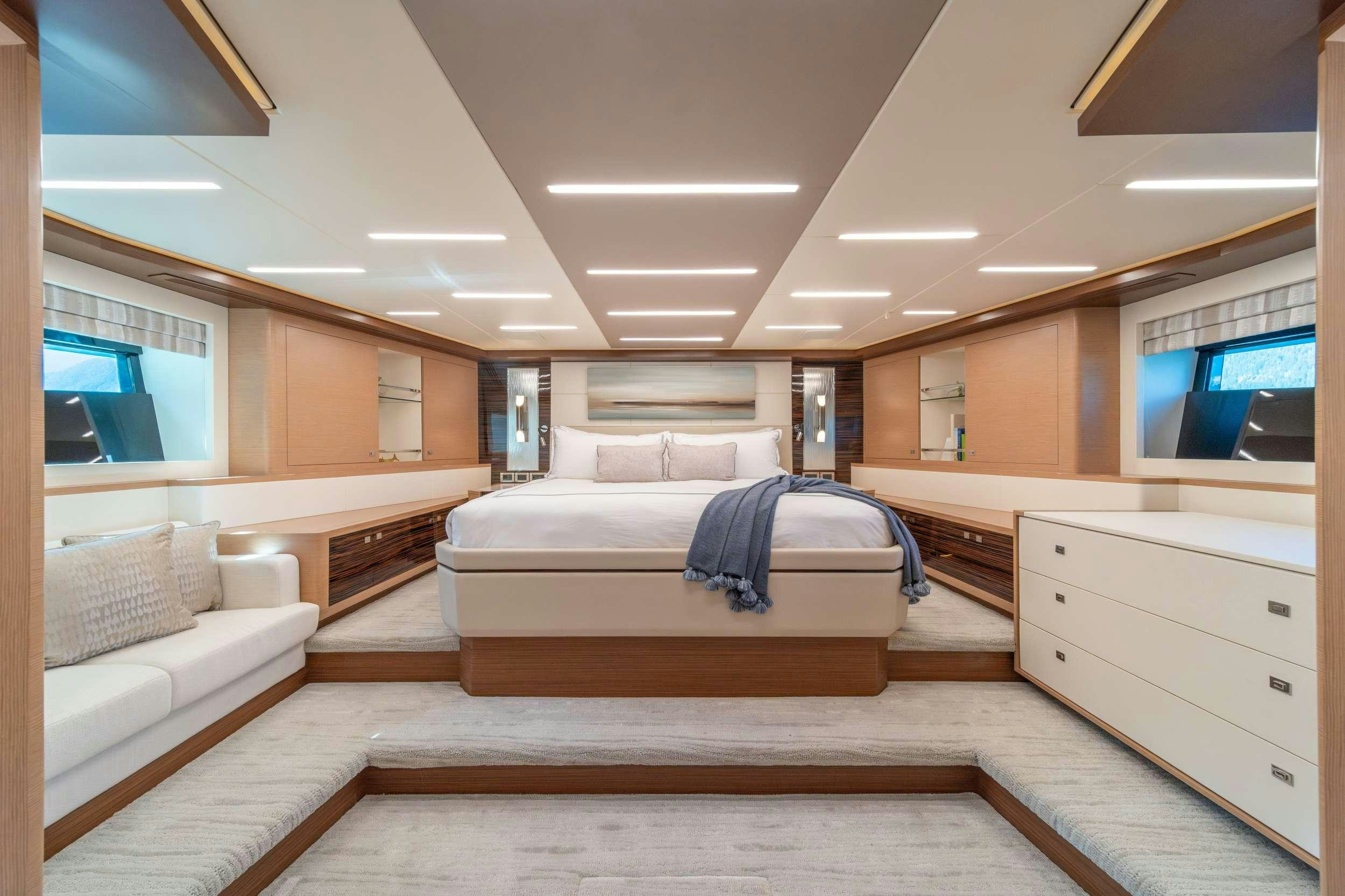 a room with a bed and a tv aboard VOYAGER Yacht for Charter