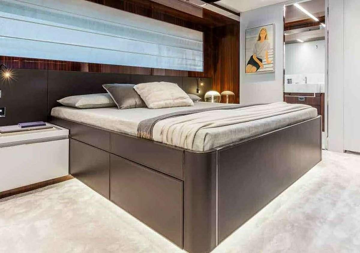 a bed with a white bed aboard BELLA DONNA Yacht for Charter