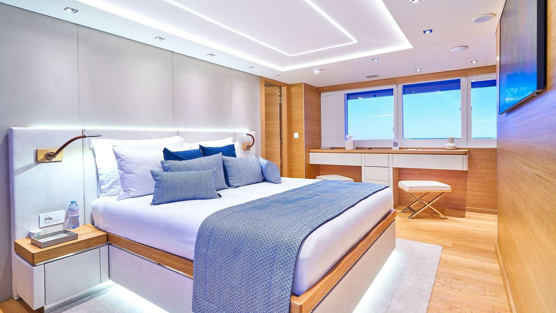 a bed in a room aboard ARGO Yacht for Charter
