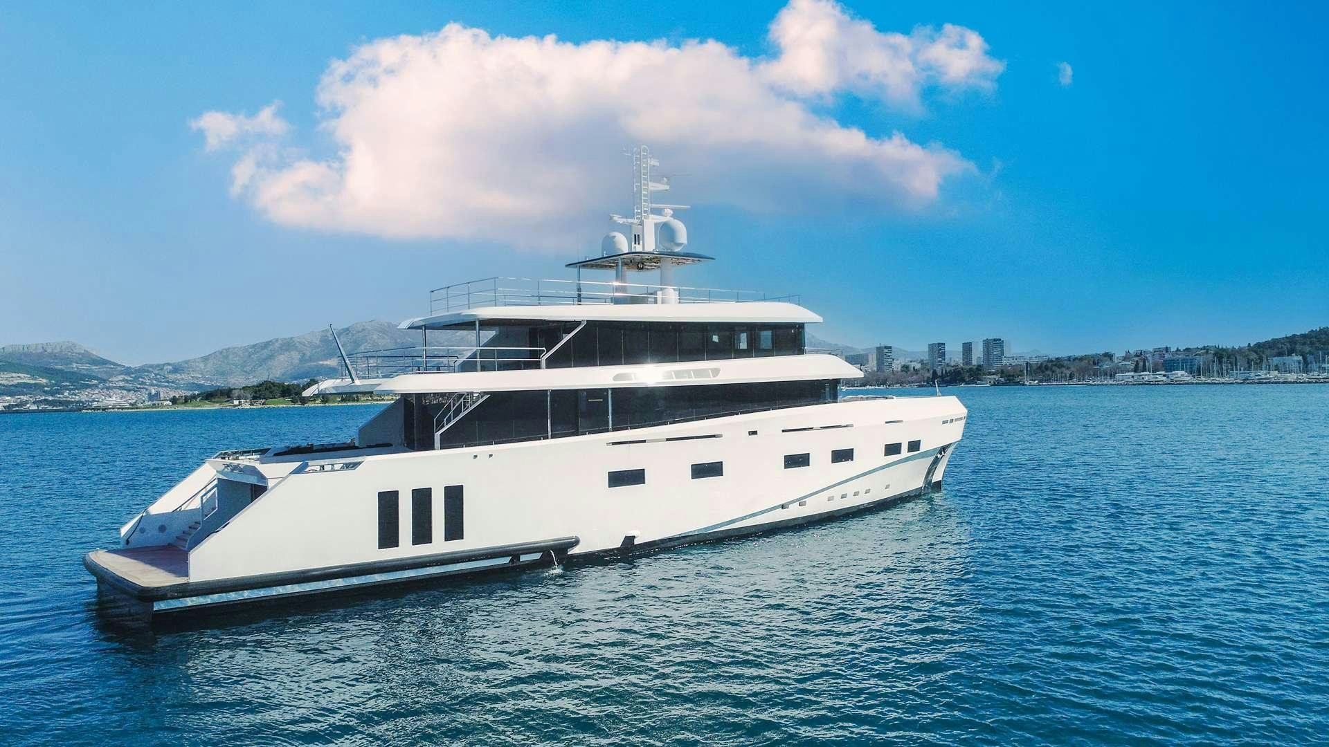 a large white boat in the water aboard RENATA Yacht for Charter
