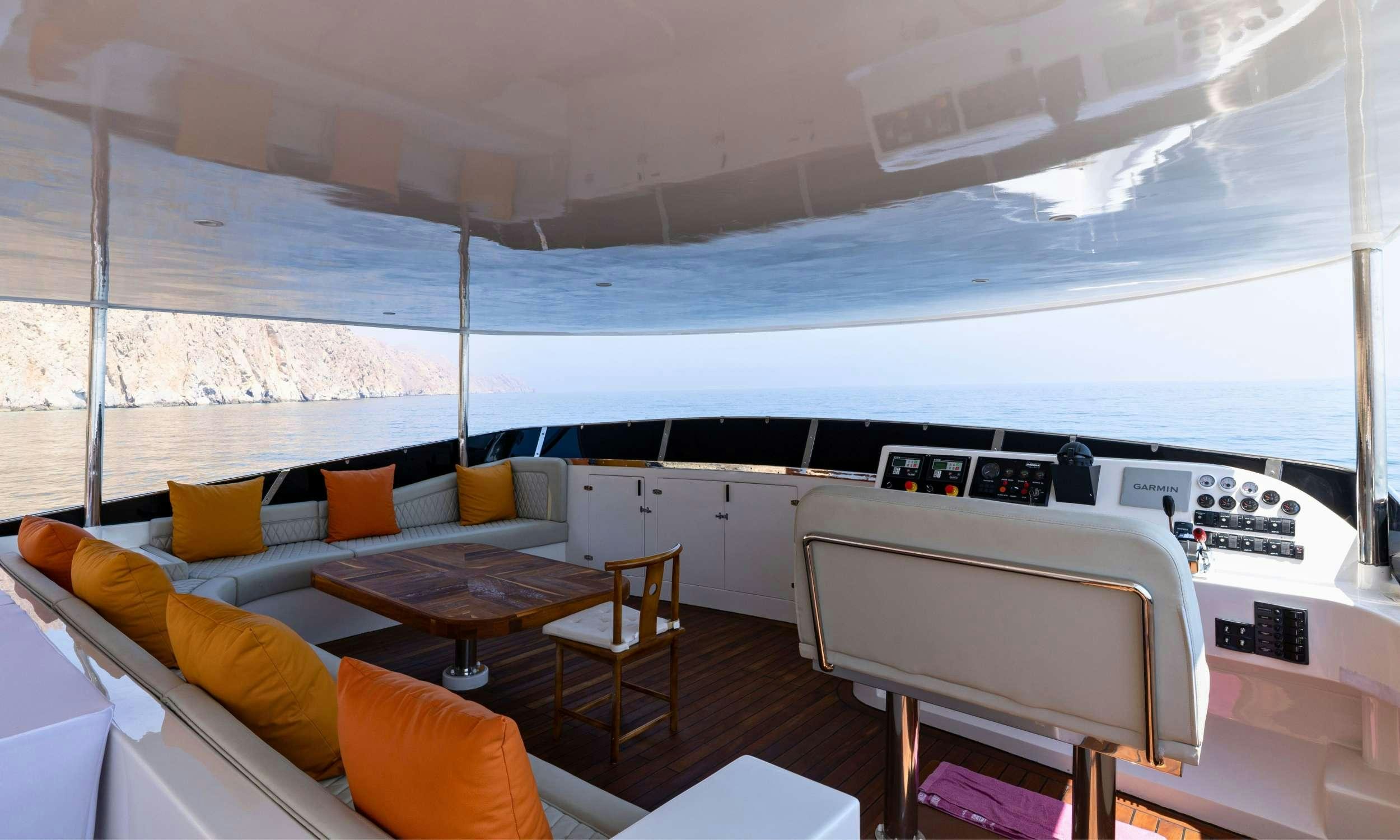 a room with a bed and a desk aboard VISION Yacht for Charter