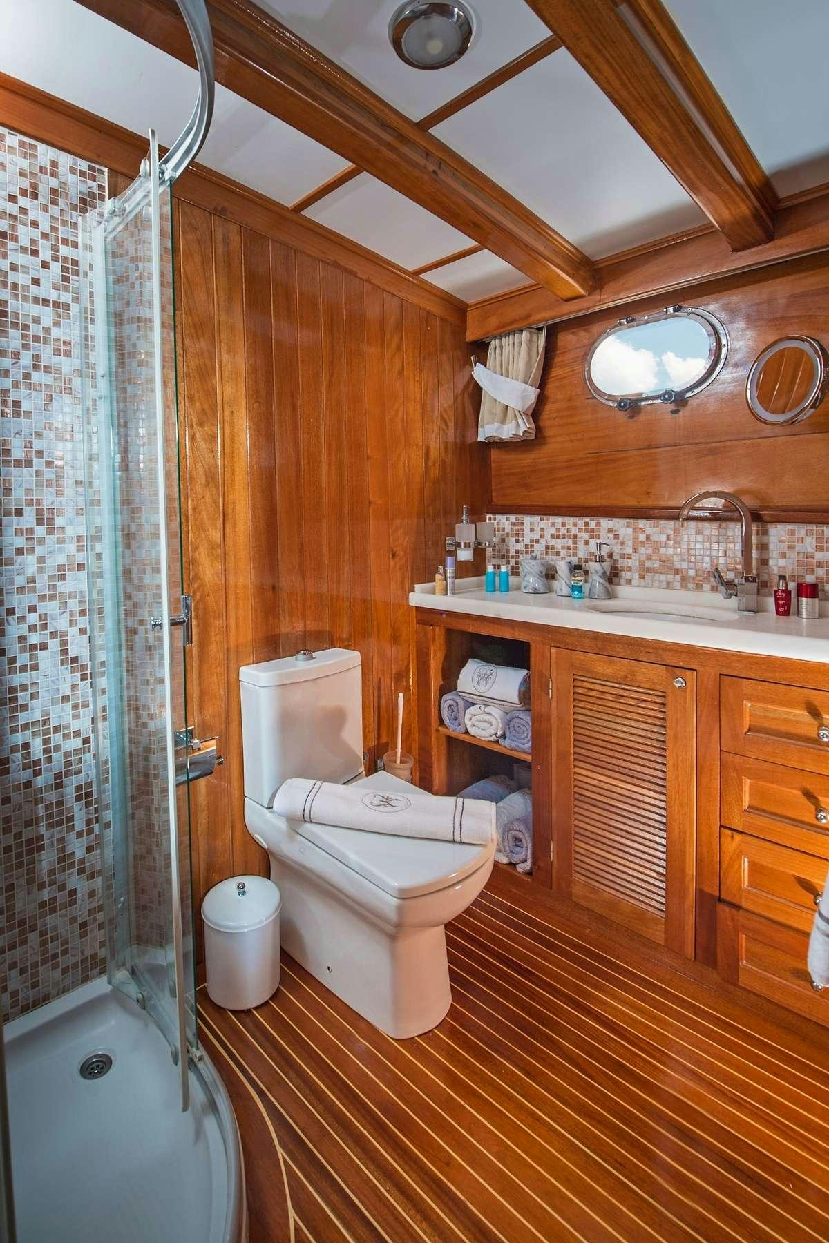 a bathroom with a toilet and sink aboard PARSS Yacht for Charter
