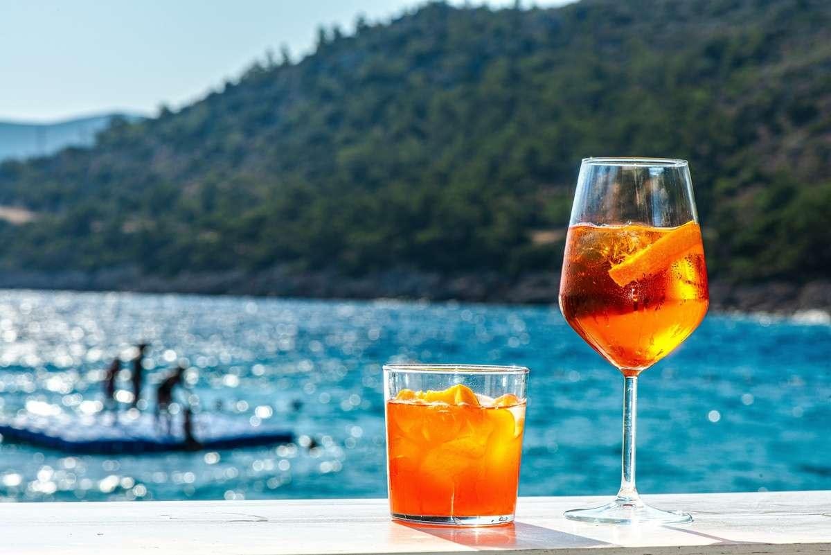two glasses of liquid on a table aboard FORTUNA Yacht for Charter