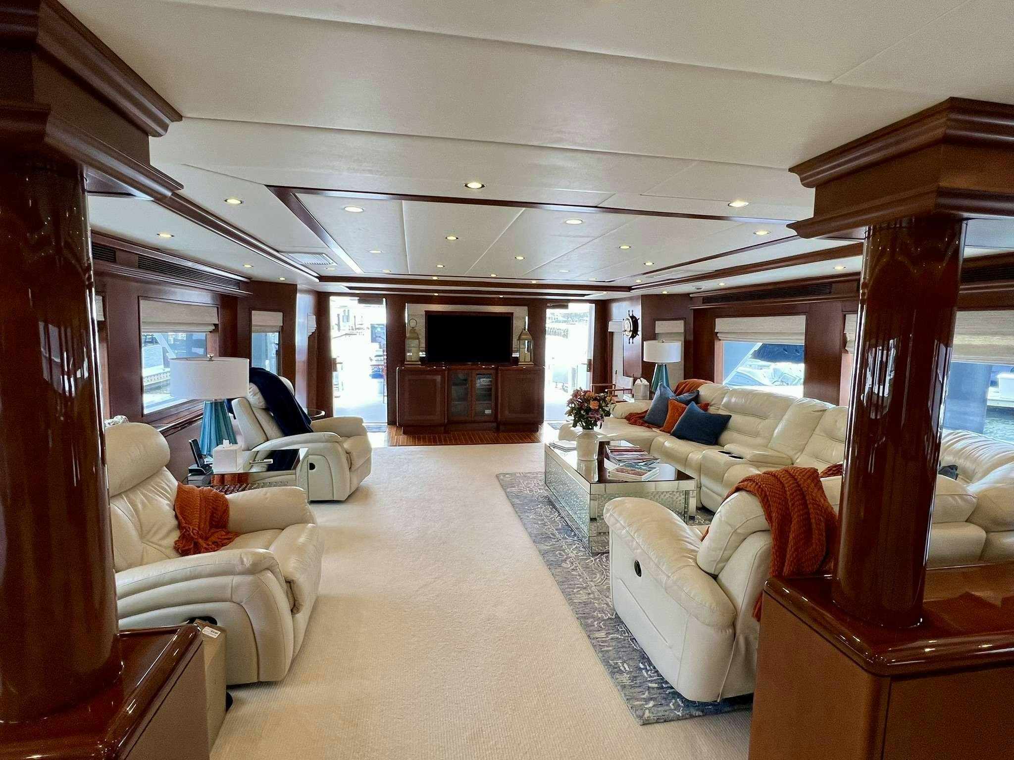 a living room with a large window aboard ESCAPE Yacht for Charter