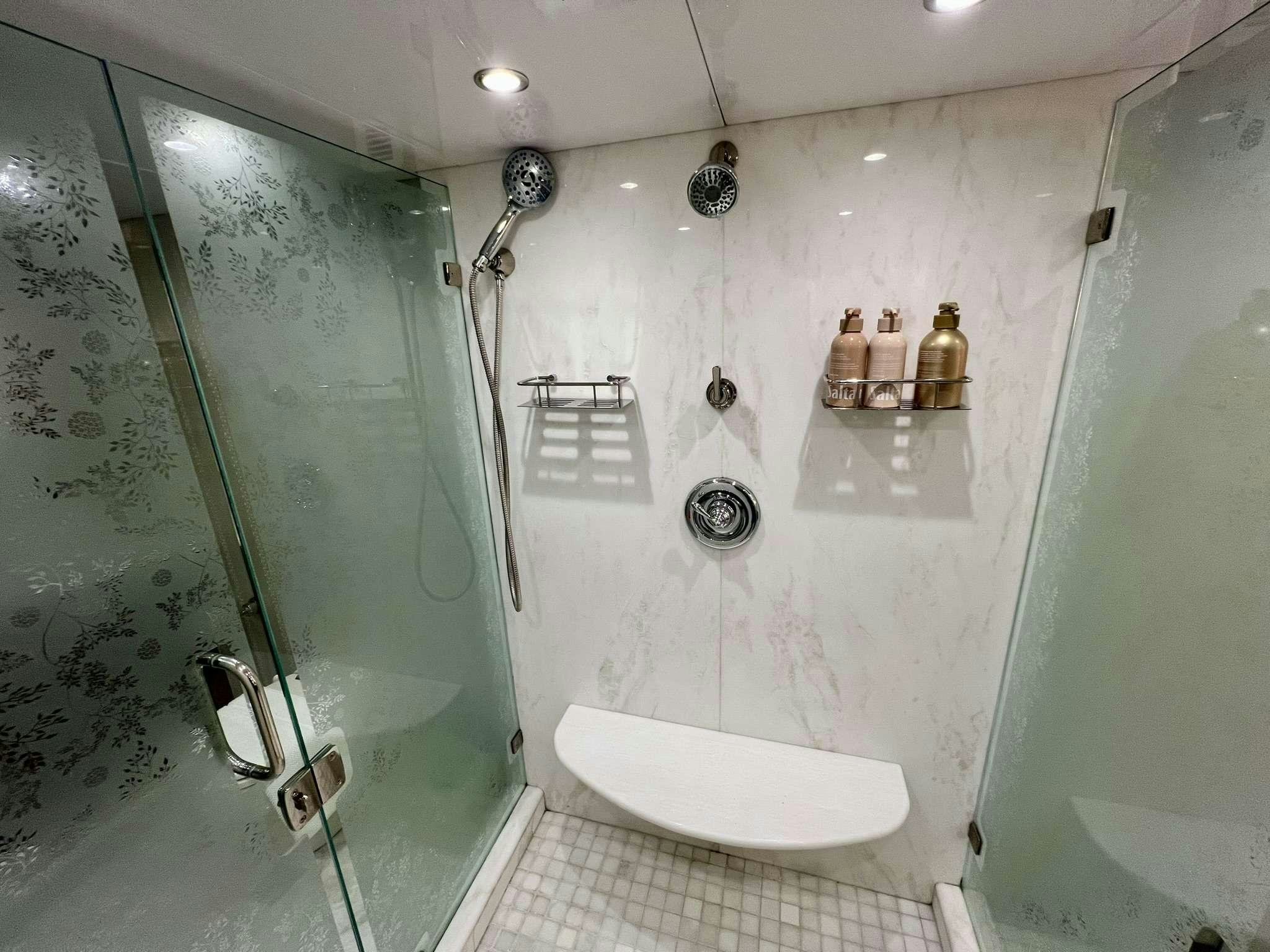 a bathroom with a shower and a sink aboard ESCAPE Yacht for Charter