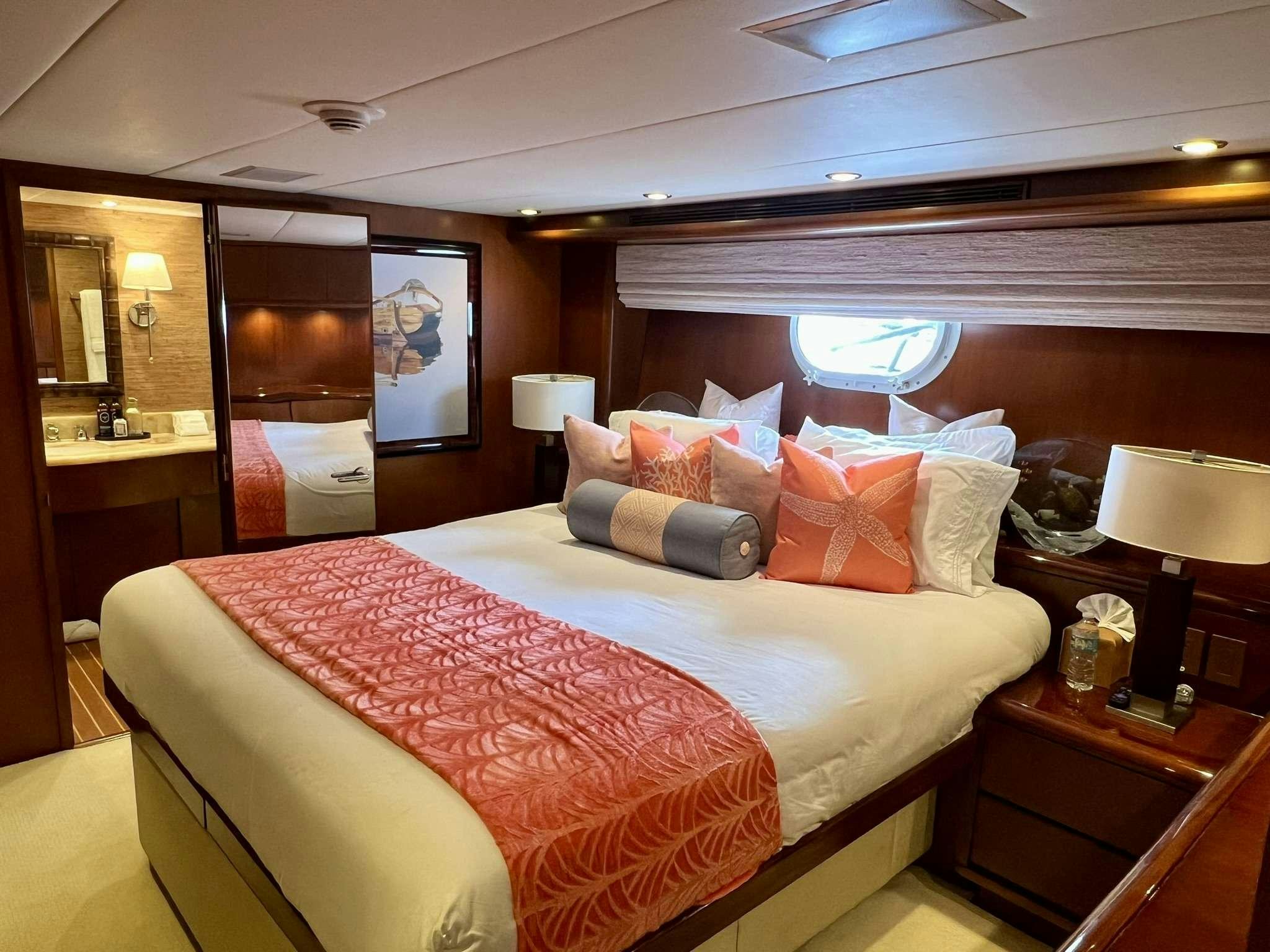 a hotel room with a bed aboard ESCAPE Yacht for Charter