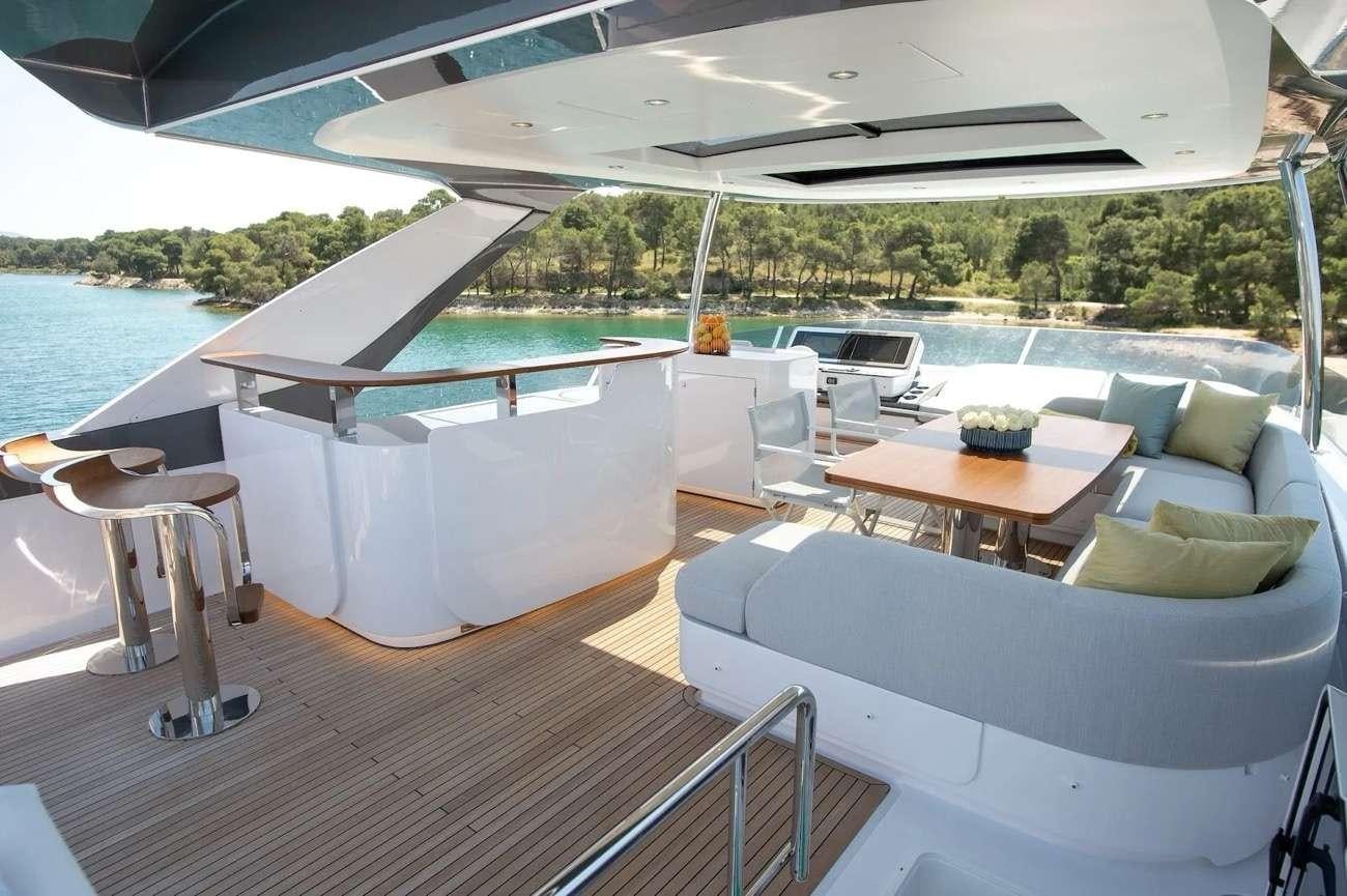 a room with a table and chairs aboard PREWI Yacht for Charter