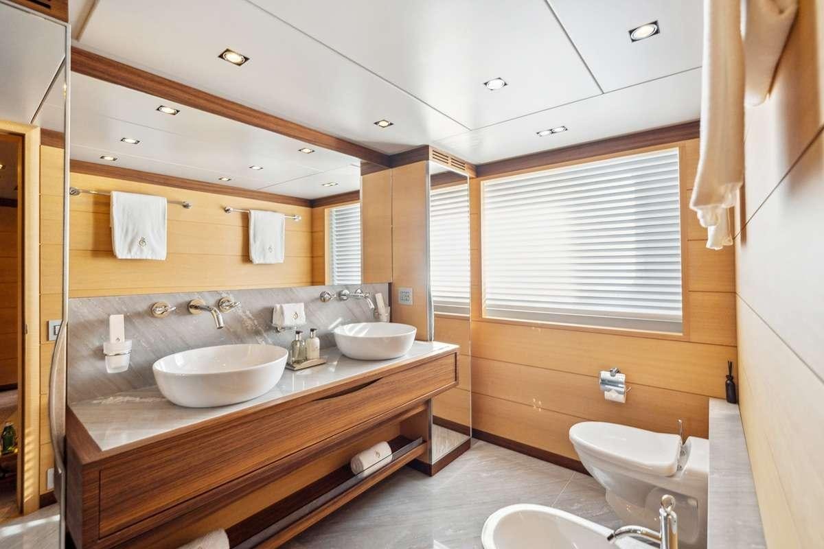 a bathroom with sinks and mirrors aboard BOMBAY Yacht for Charter