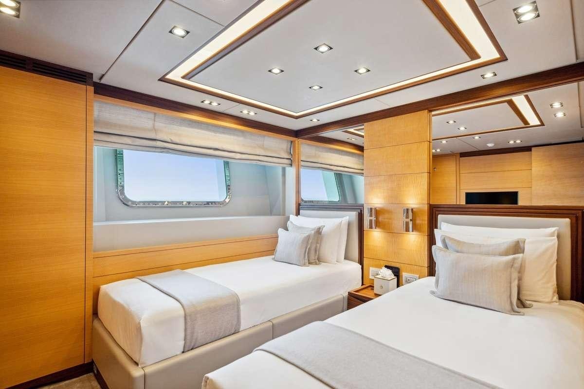 a room with two beds aboard BOMBAY Yacht for Charter