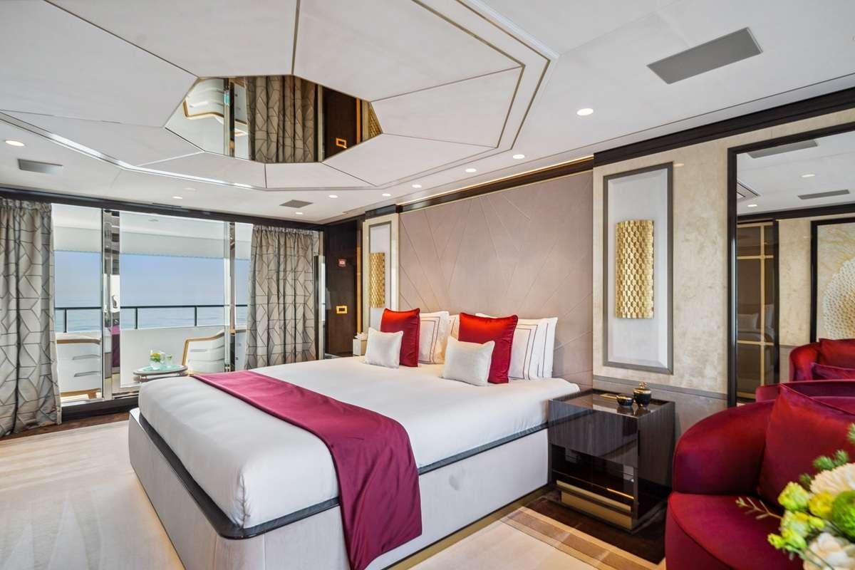 a bed in a room aboard BOMBAY Yacht for Charter
