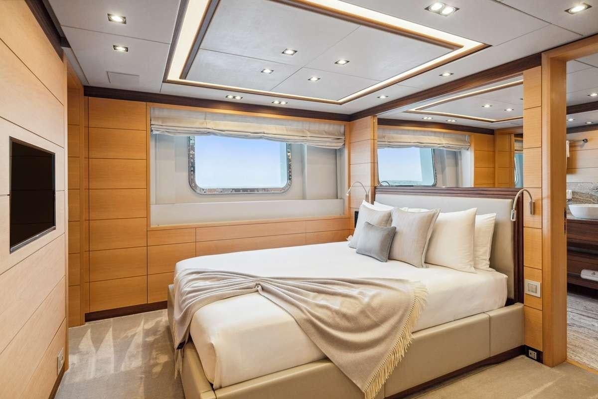a bed in a room aboard BOMBAY Yacht for Charter