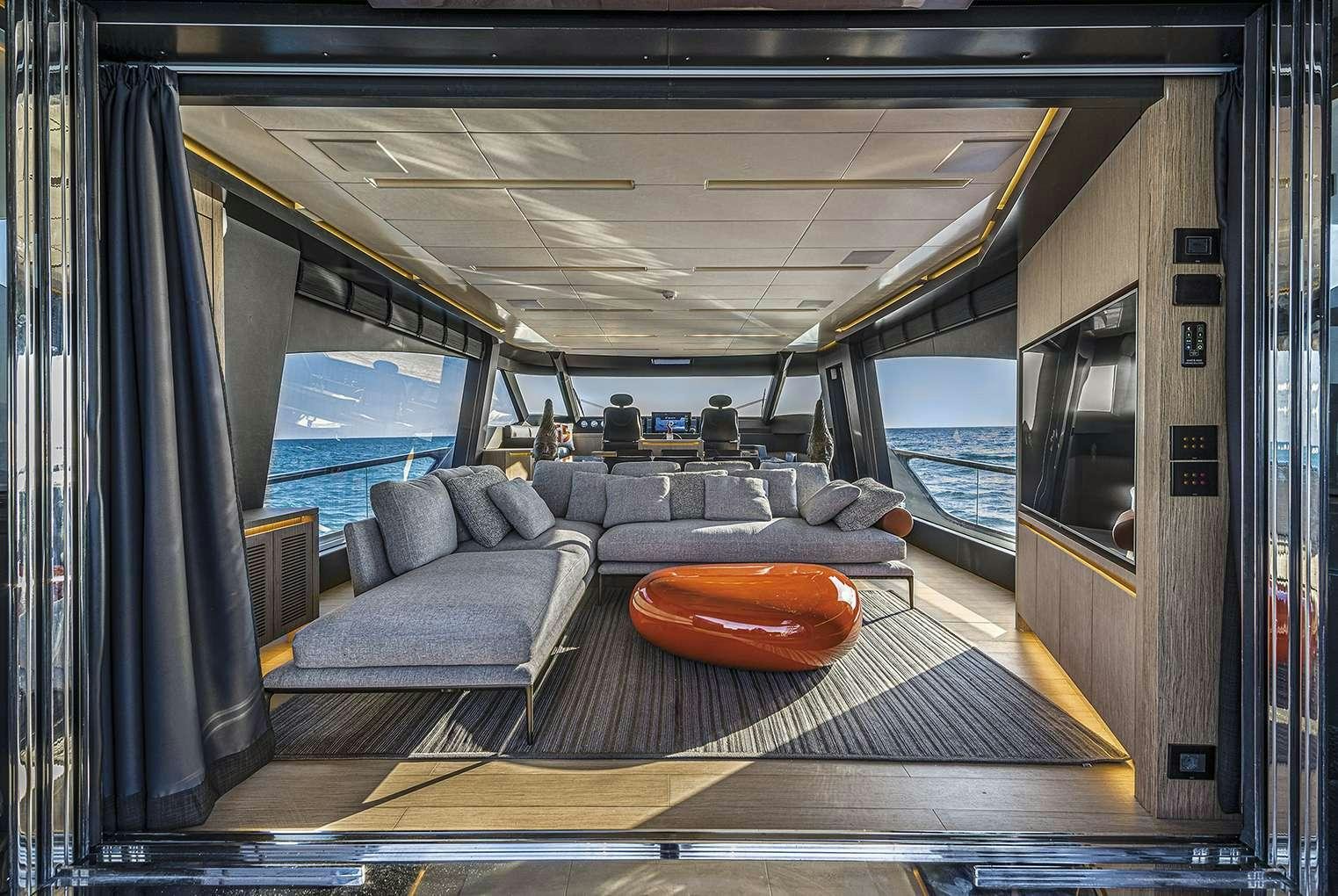 a train with a couch and a seat aboard G-FIVE Yacht for Charter