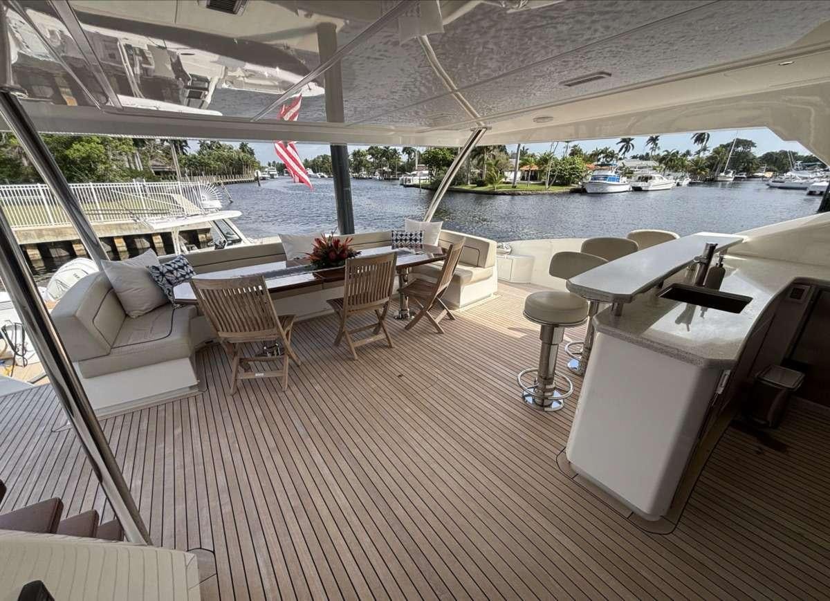 a boat with a table and chairs on it aboard INDIGO Yacht for Charter