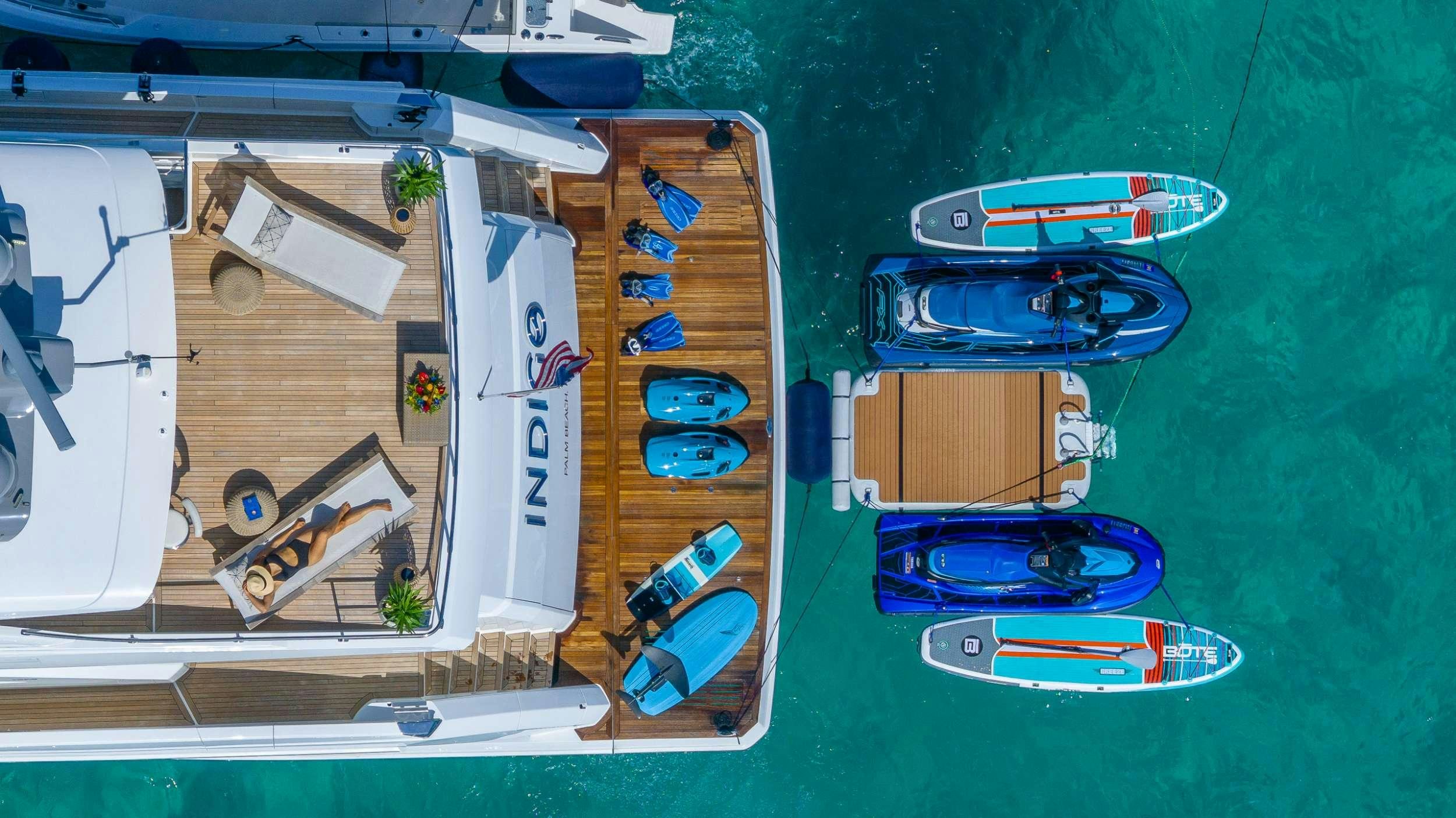 a group of objects on a green surface aboard INDIGO Yacht for Charter