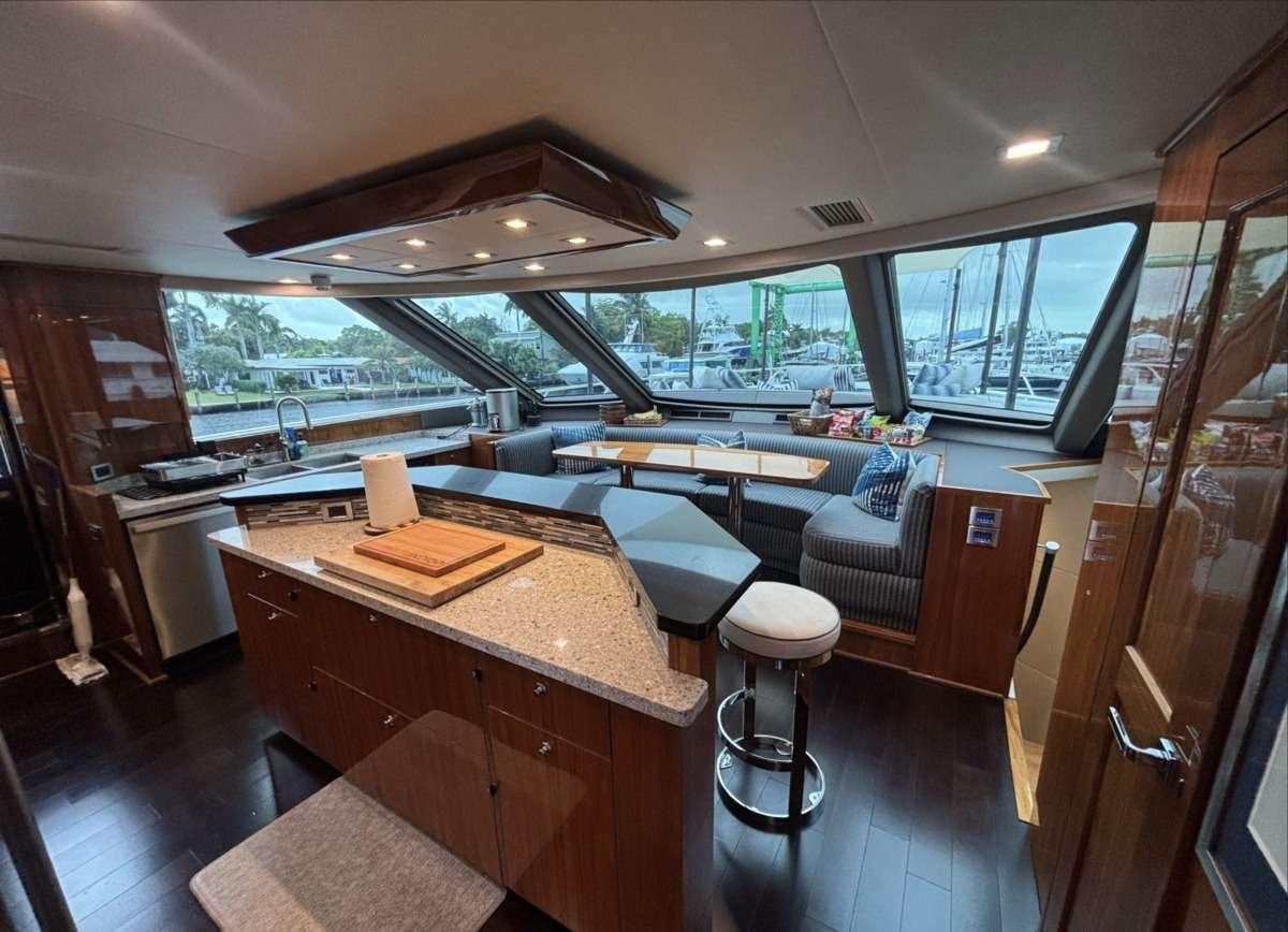 a kitchen with a bar and a bar aboard INDIGO Yacht for Charter
