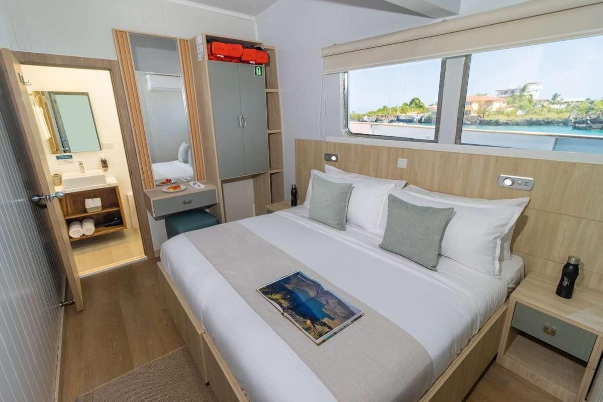 a bed in a room aboard GALAPAGOS ANGEL Yacht for Charter