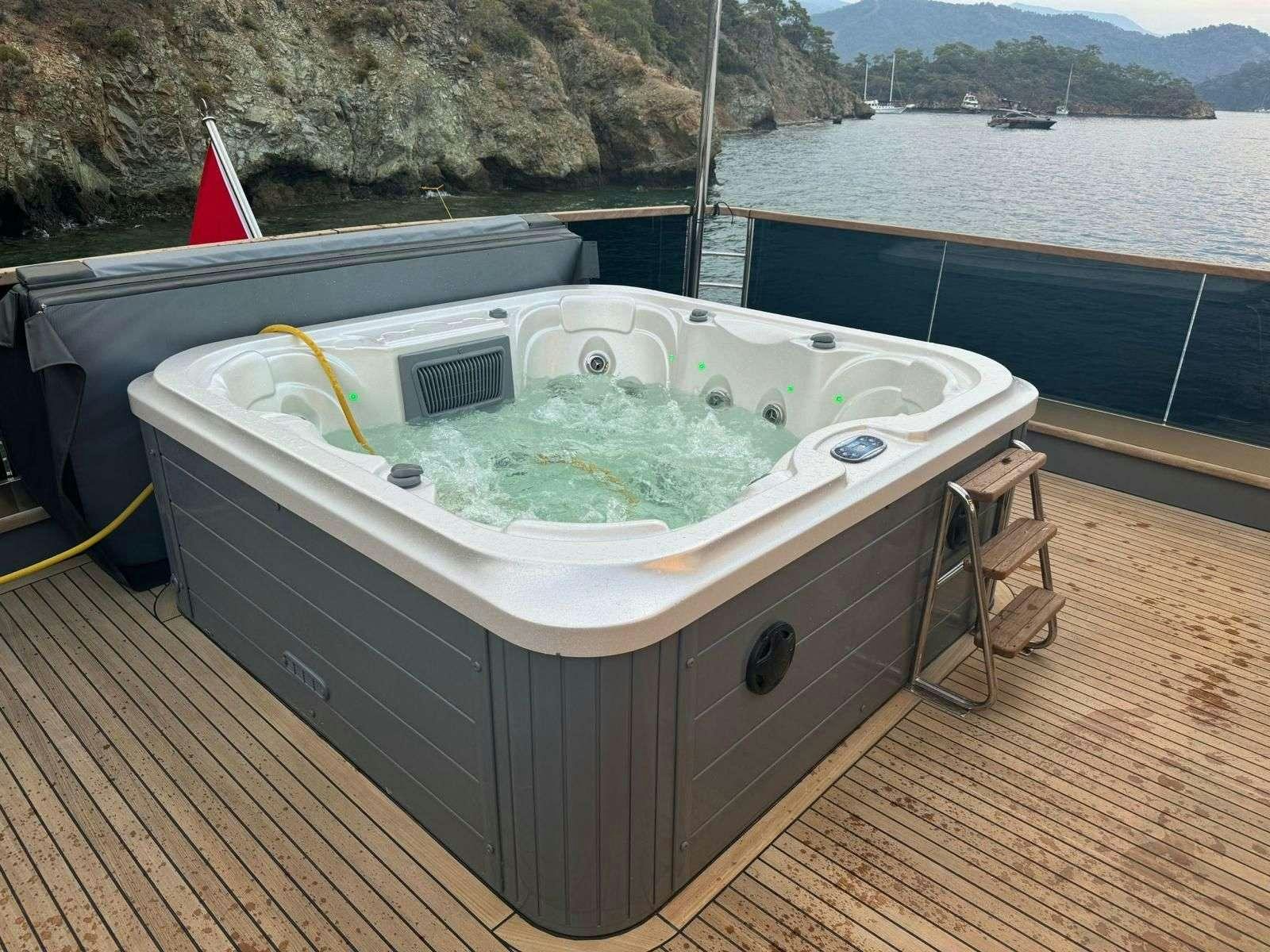 a boat with a bucket of ice aboard BEYEFENDI H Yacht for Charter