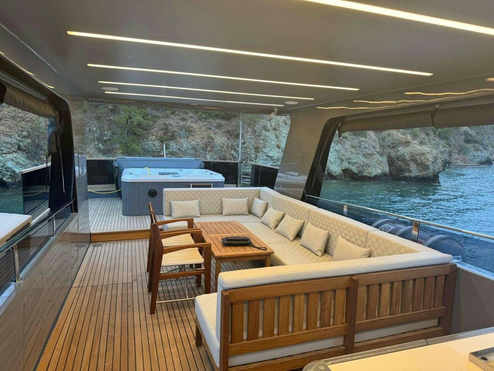 a living room with a large pool aboard BEYEFENDI H Yacht for Charter