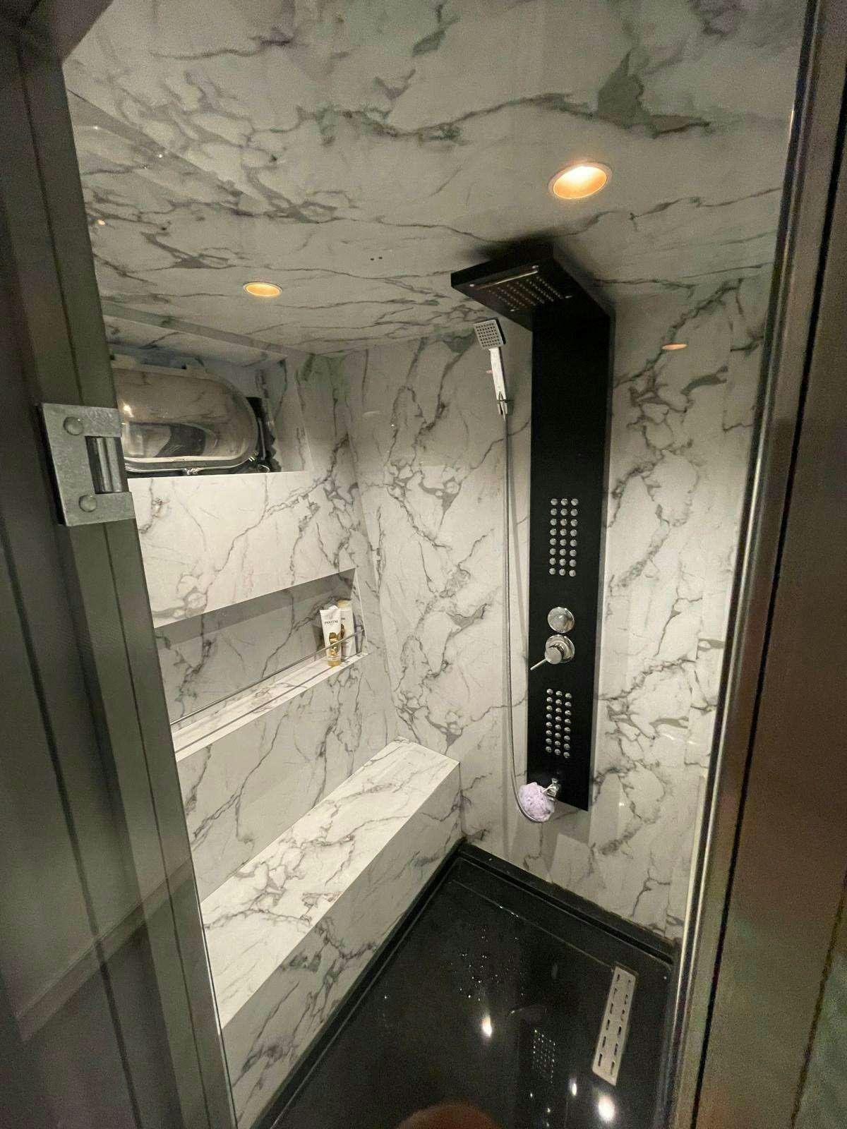 a room with a sink and a mirror aboard BEYEFENDI H Yacht for Charter