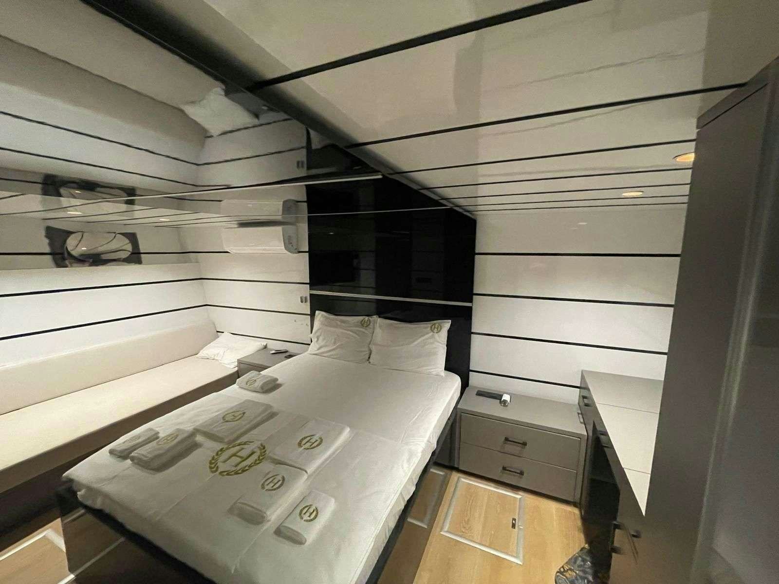a bed in a room aboard BEYEFENDI H Yacht for Charter