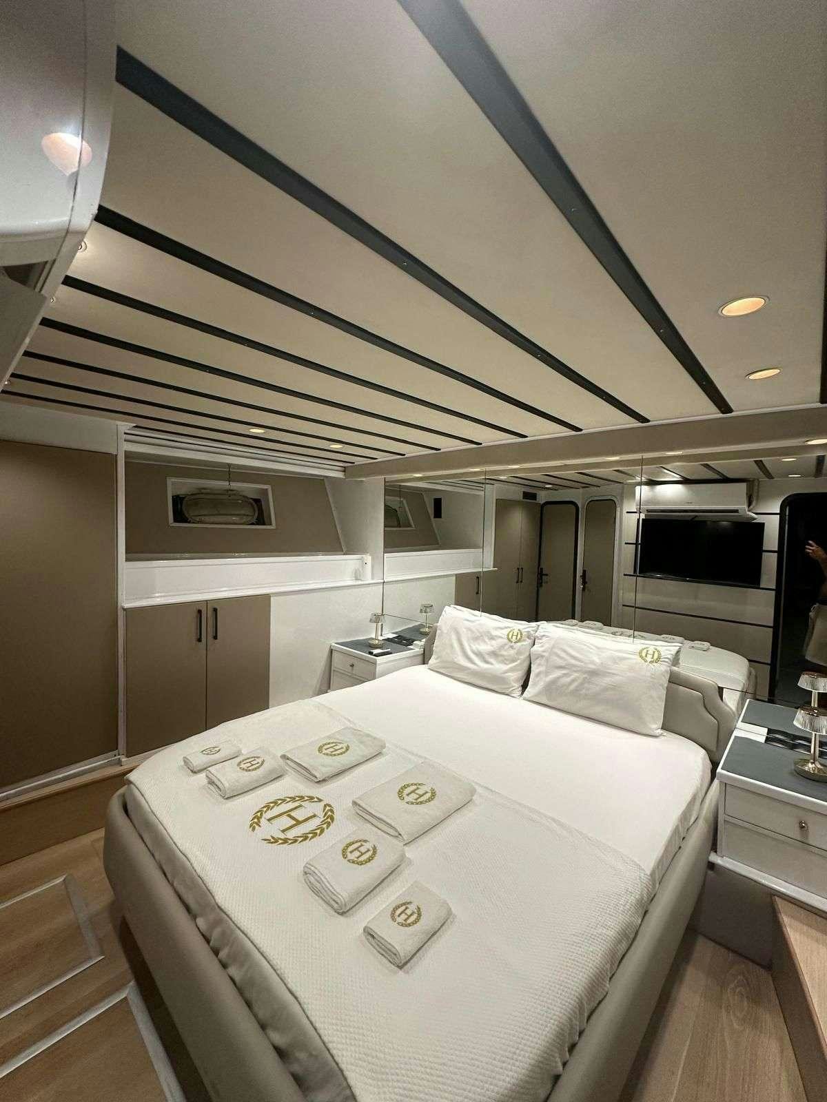 a bed in a room aboard BEYEFENDI H Yacht for Charter