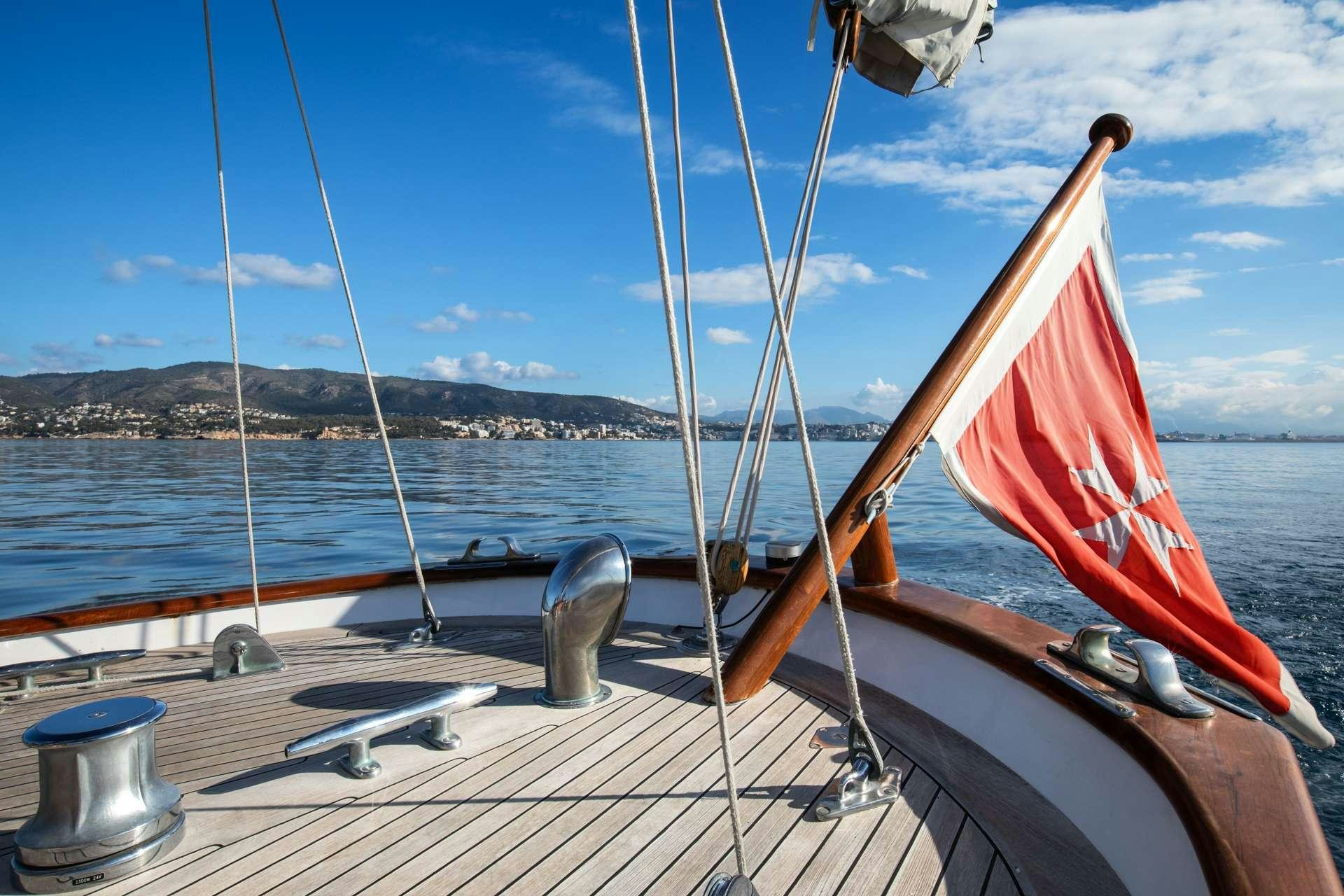 a sailboat on a dock aboard GAEL I Yacht for Charter