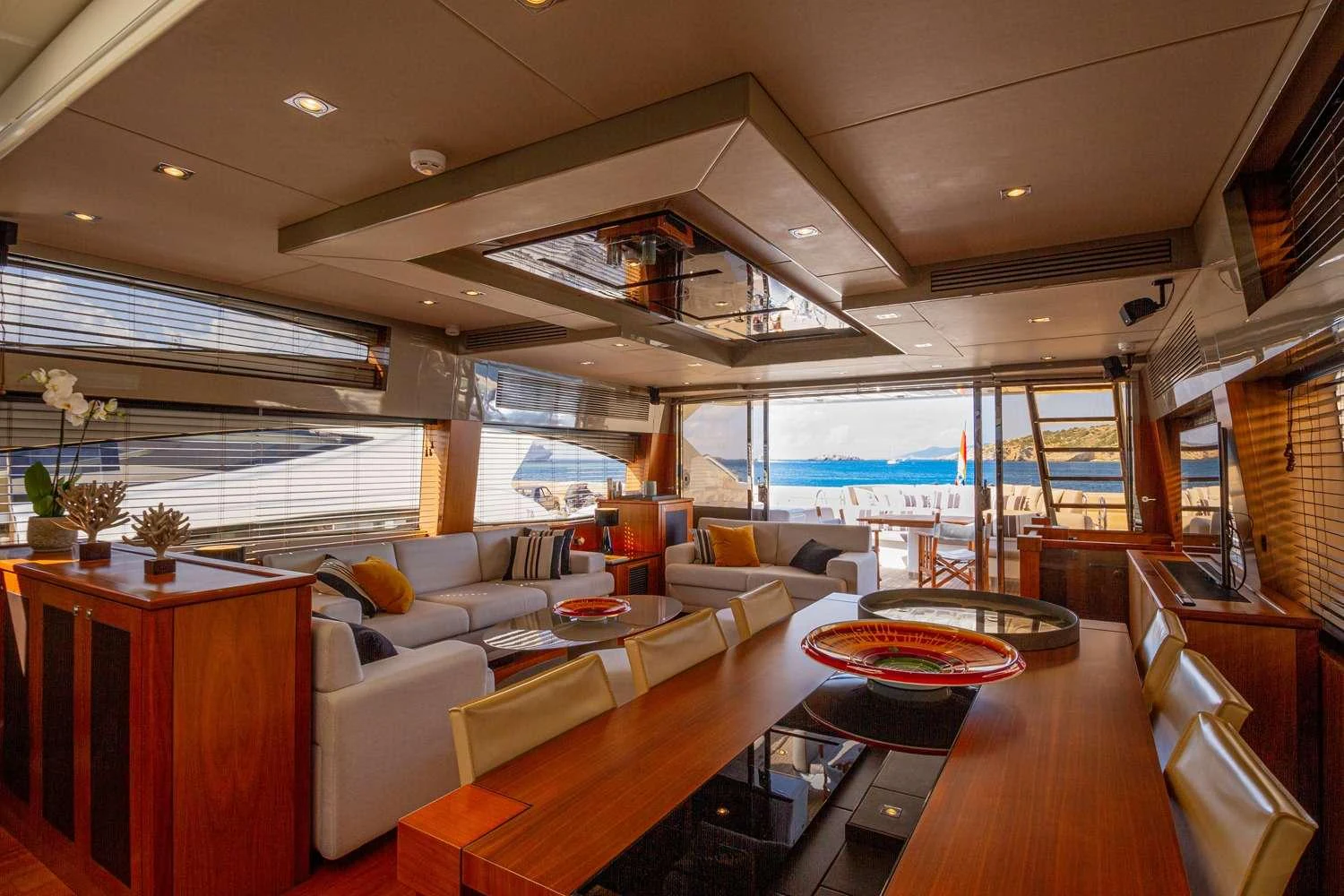 a living room with a large window aboard BASAD Yacht for Charter
