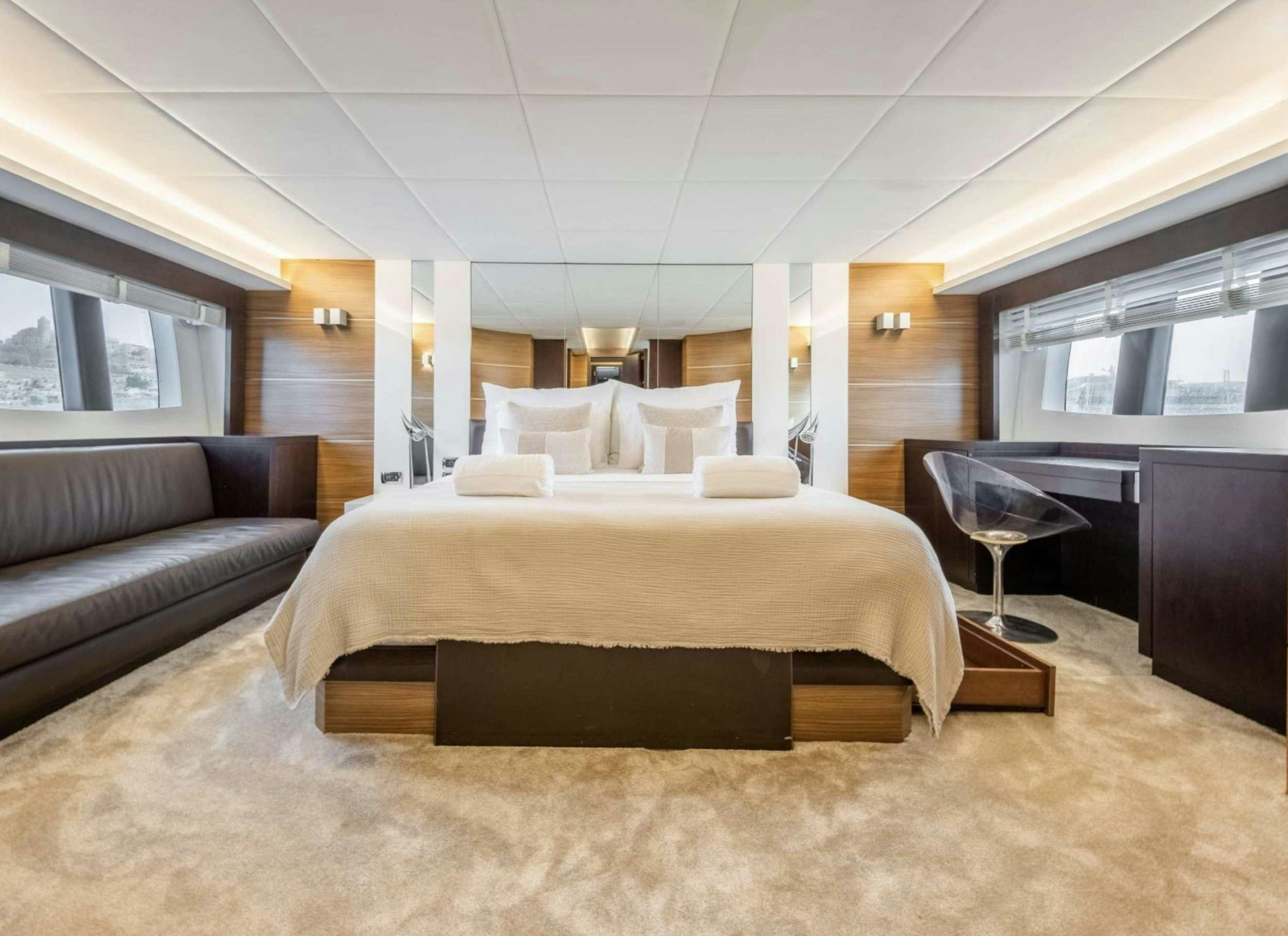 a large bed in a room aboard BISCAYNE Yacht for Charter