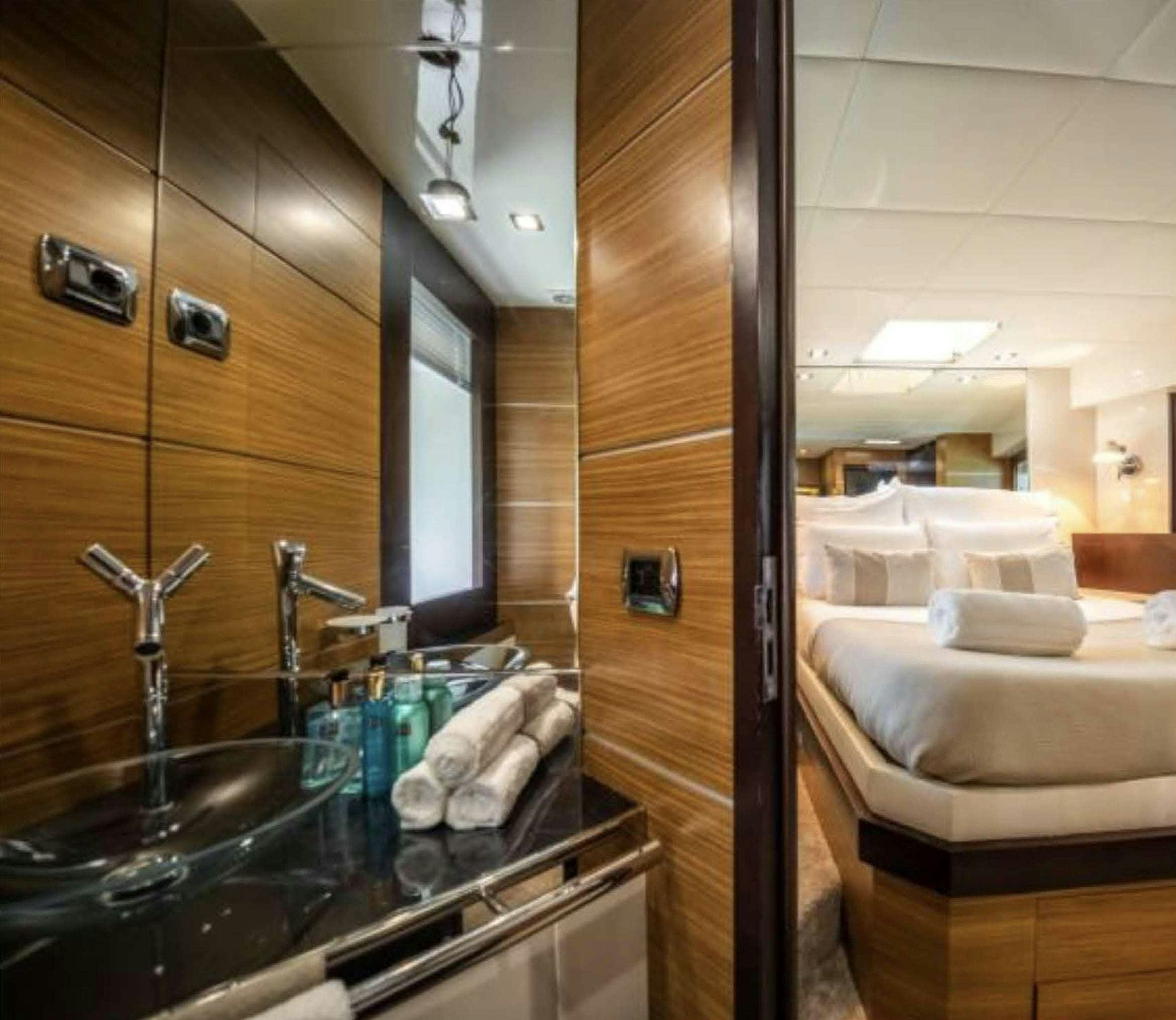 a bathroom with a sink and a mirror aboard BISCAYNE Yacht for Charter