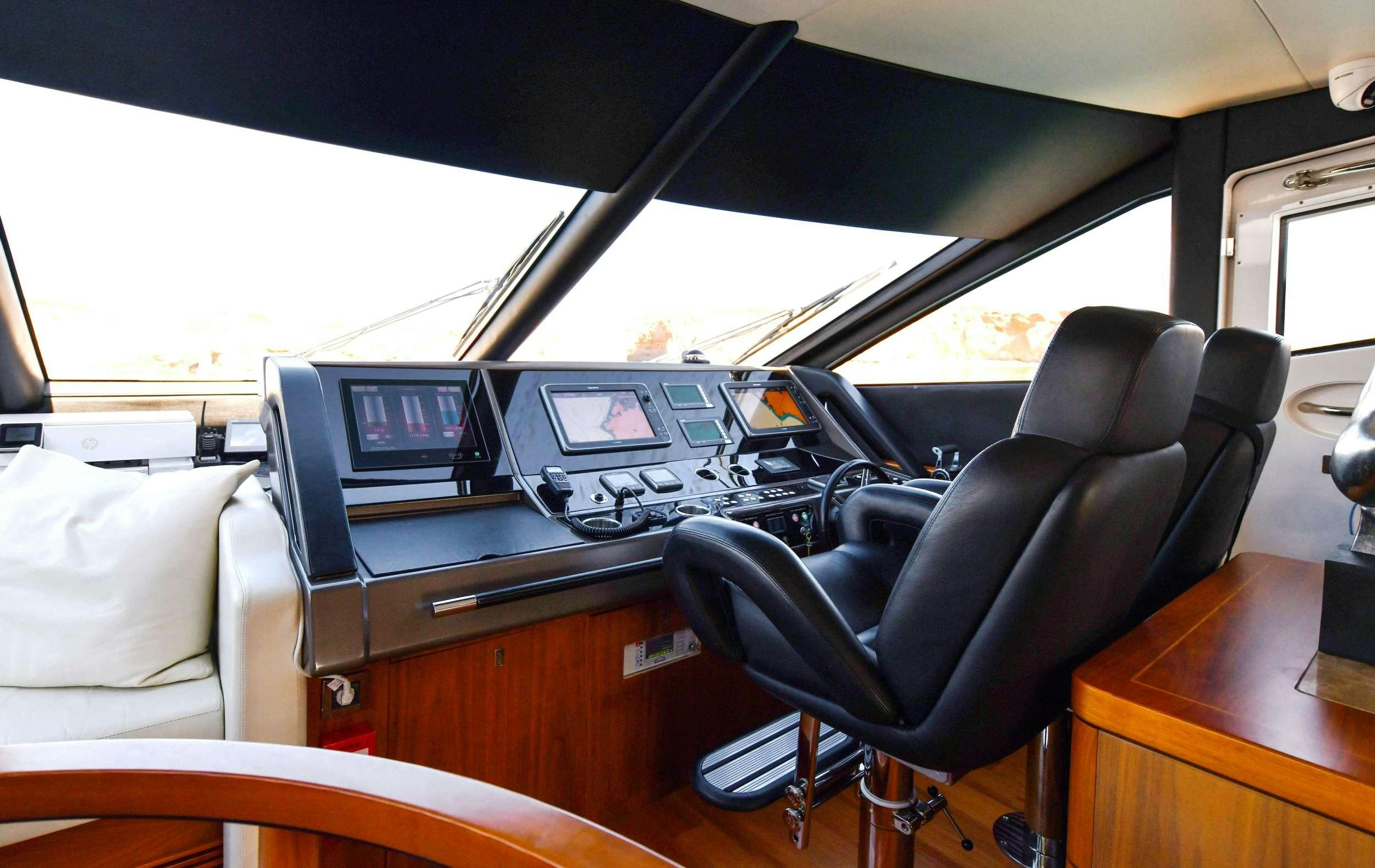 a car with a desk and a chair aboard GRACE XI Yacht for Charter