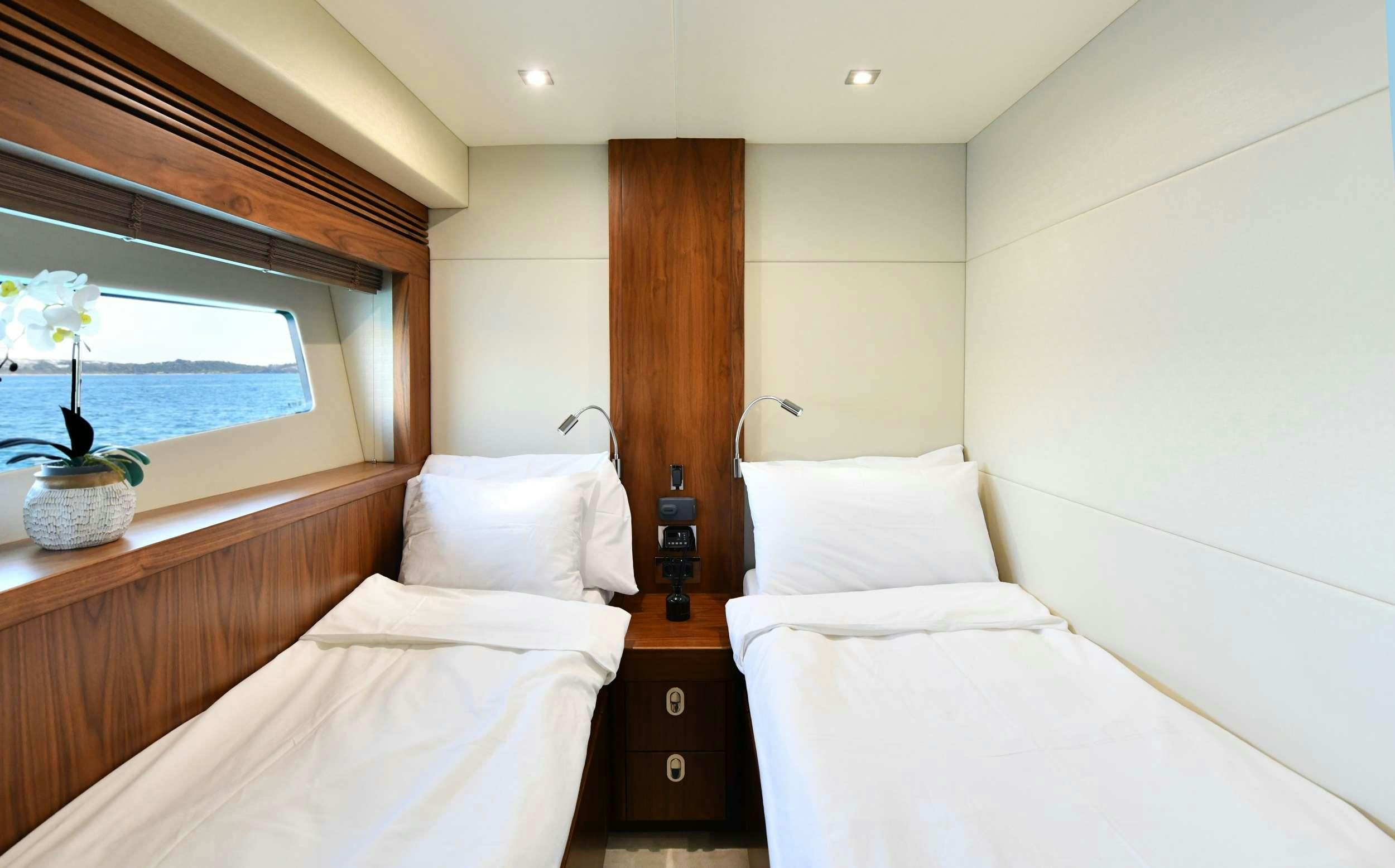 a room with two beds aboard GRACE XI Yacht for Charter