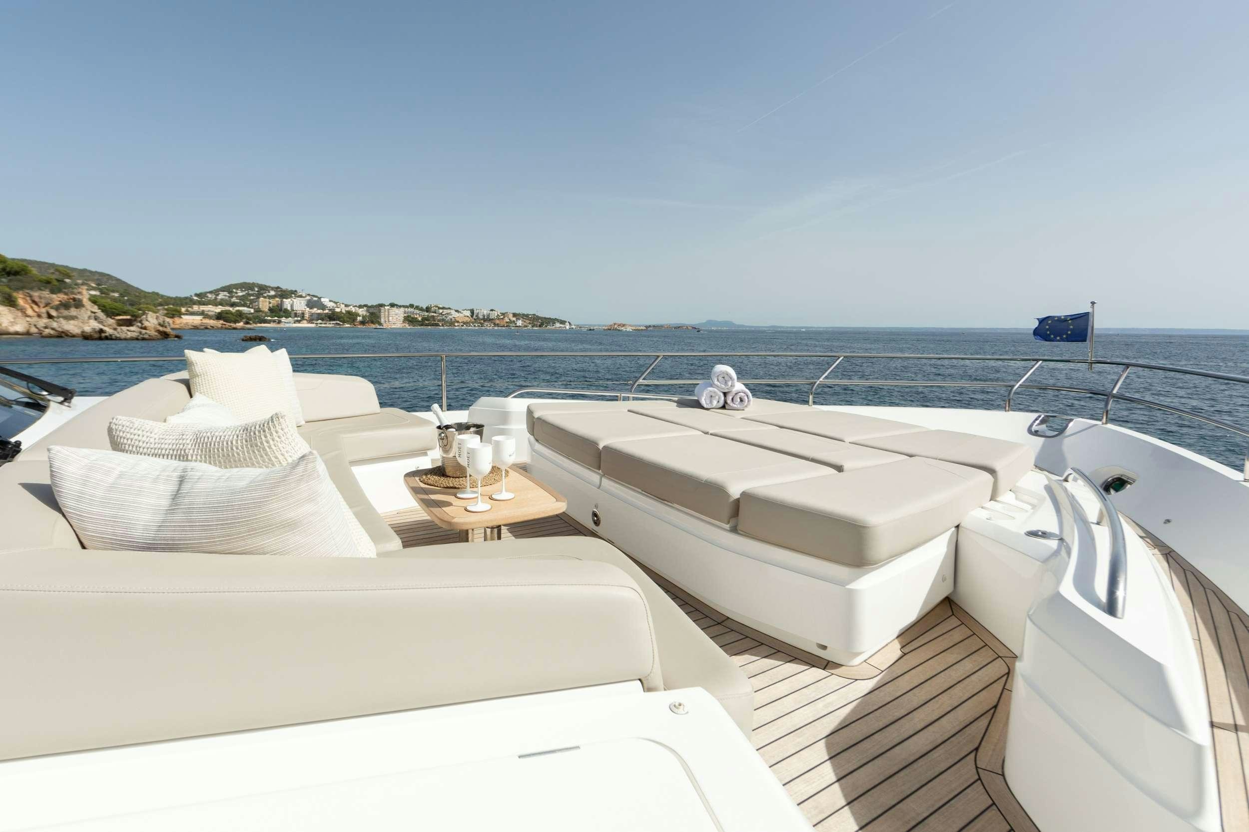 a room with a bed and a sink and a view of the ocean aboard MIO BARCO Yacht for Charter