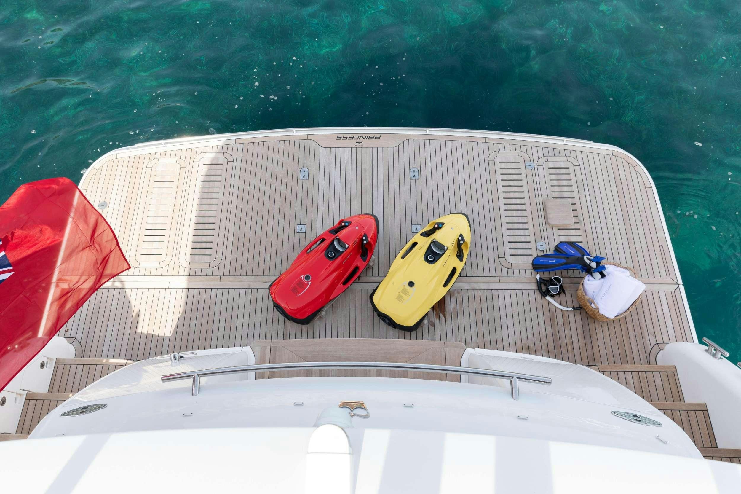 a boat with kayaks on it aboard MIO BARCO Yacht for Charter