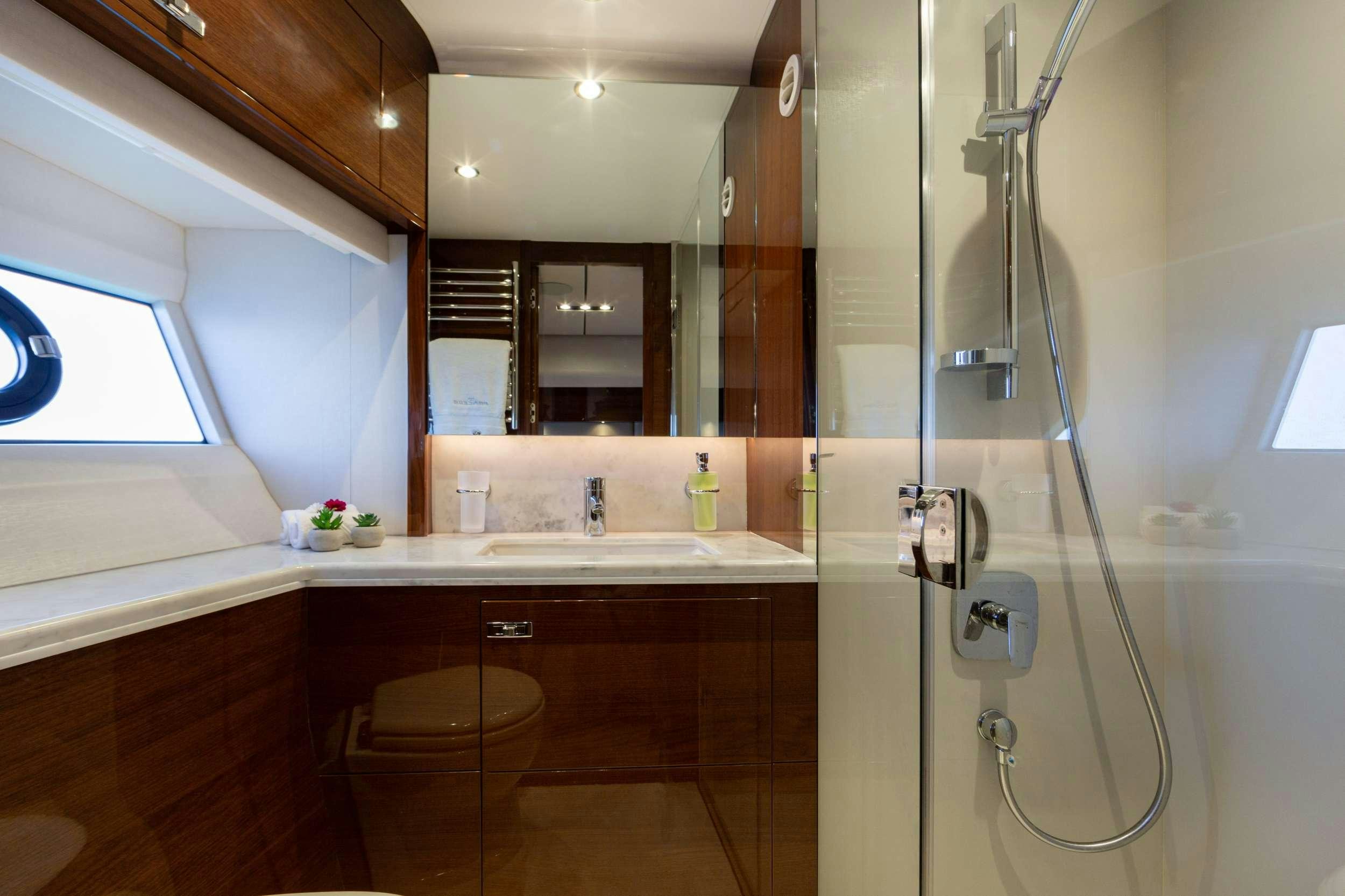 a bathroom with a shower and sink aboard MIO BARCO Yacht for Charter