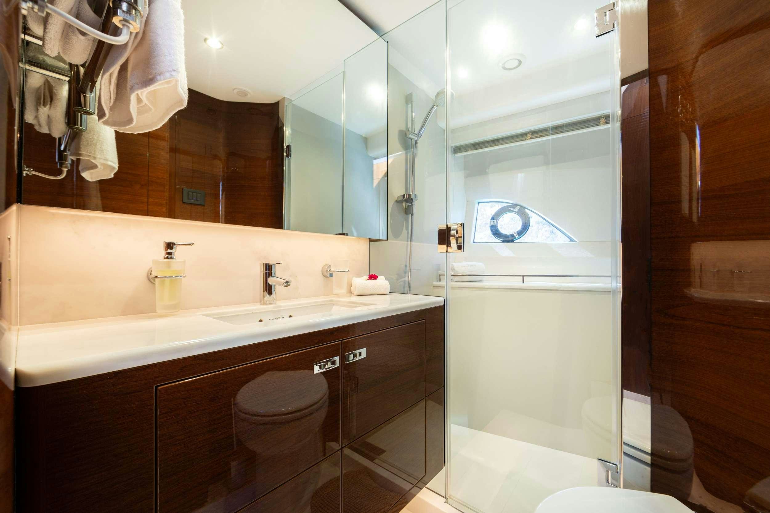 a bathroom with a large mirror aboard MIO BARCO Yacht for Charter