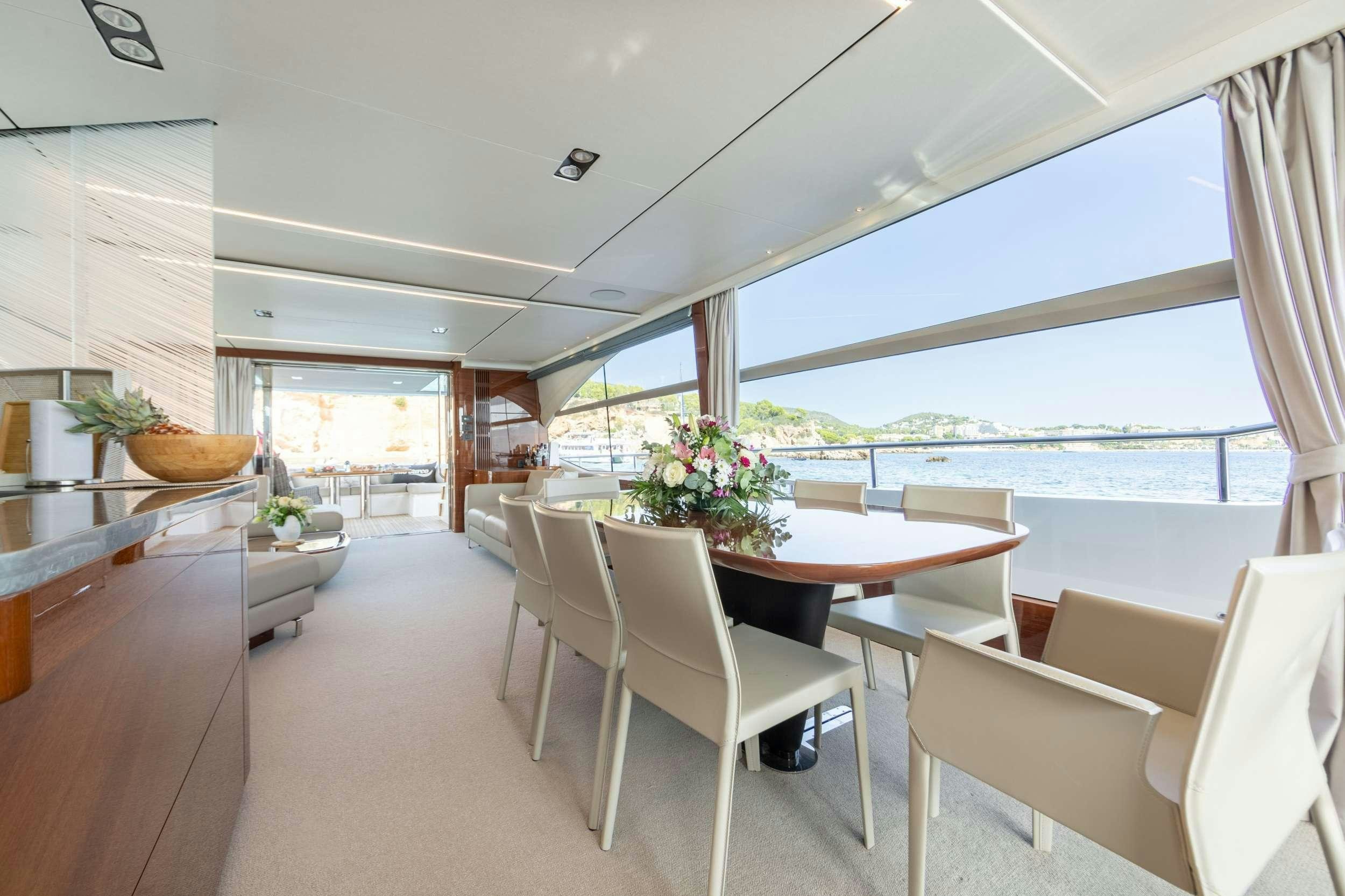 a room with a table and chairs aboard MIO BARCO Yacht for Charter