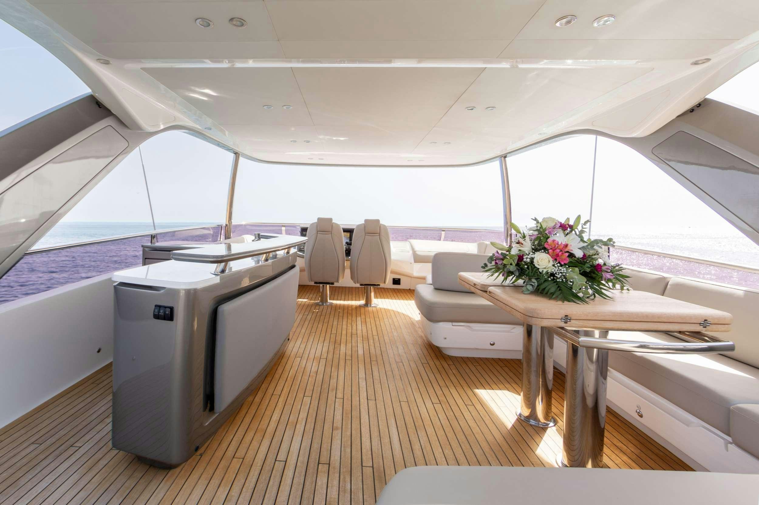 a room with a table and chairs aboard MIO BARCO Yacht for Charter