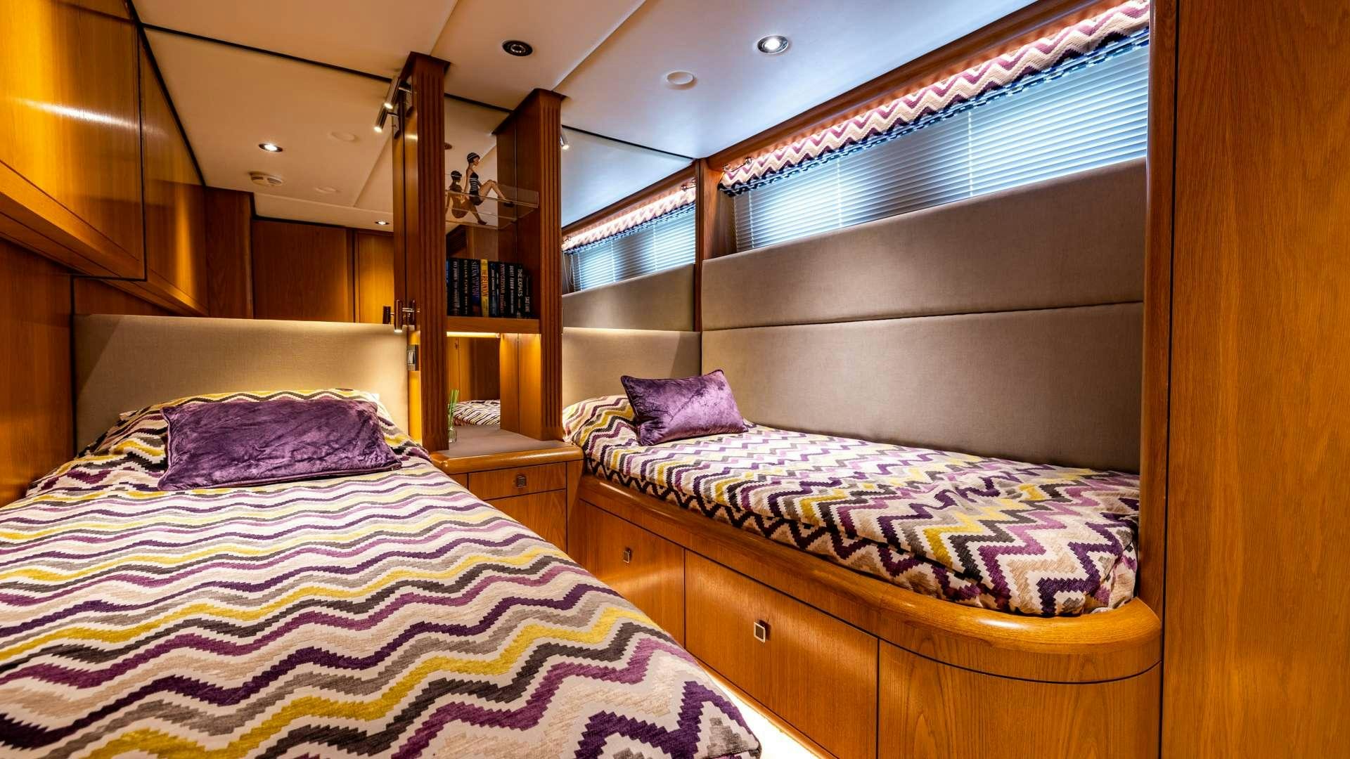 a couple of beds in a room aboard CAMENA II Yacht for Charter