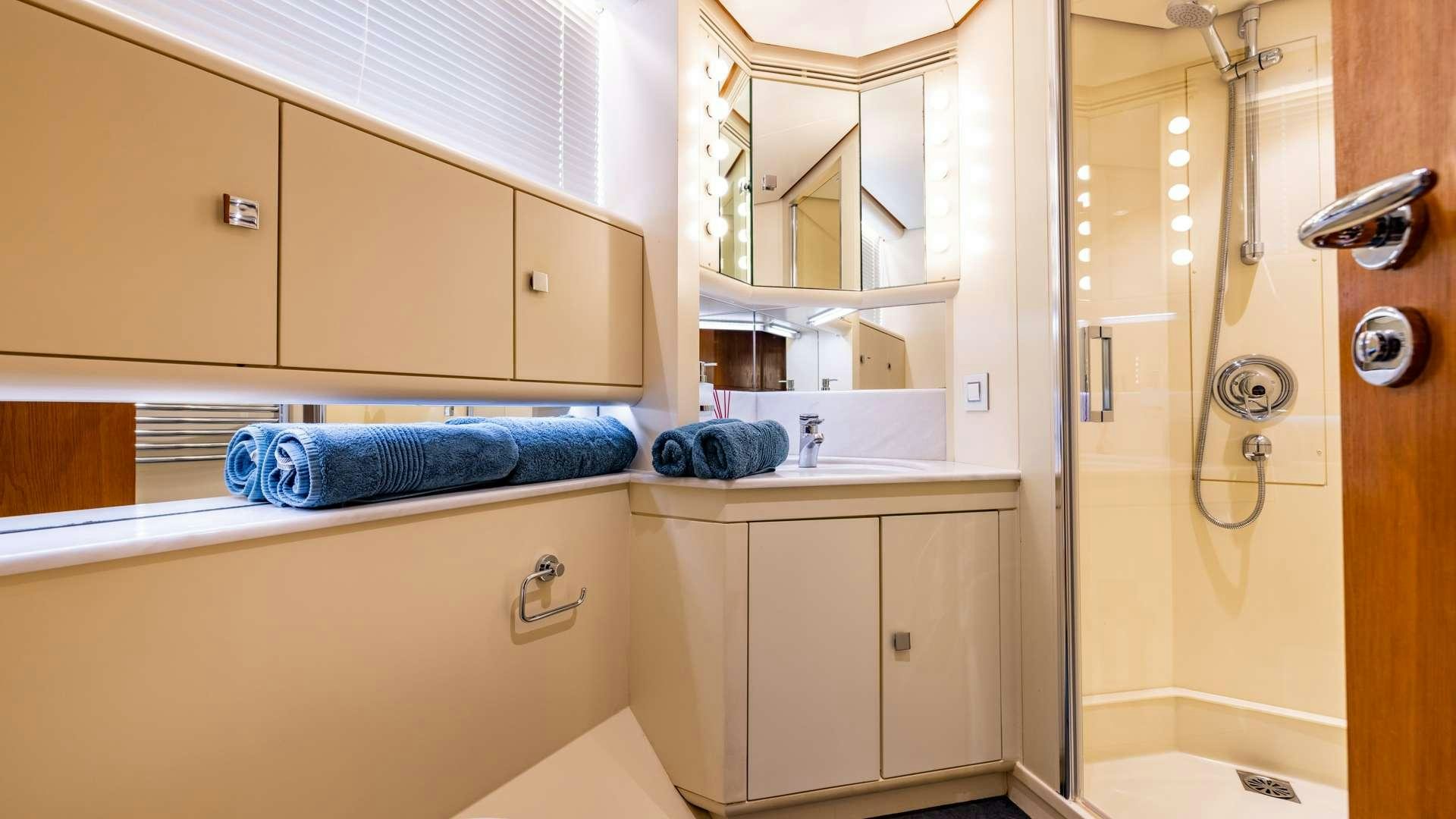 a bathroom with a shower and sink aboard CAMENA II Yacht for Charter