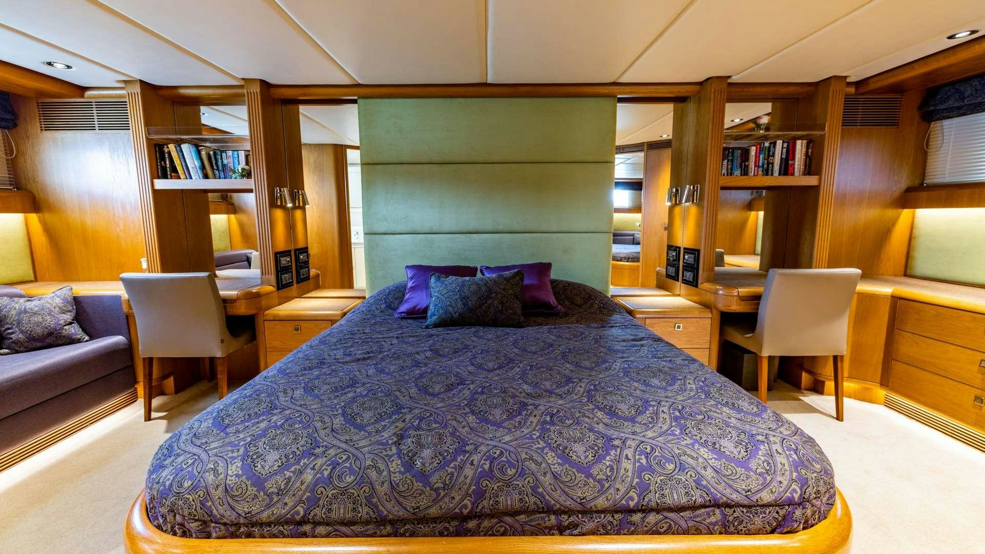 a bed in a room aboard CAMENA II Yacht for Charter