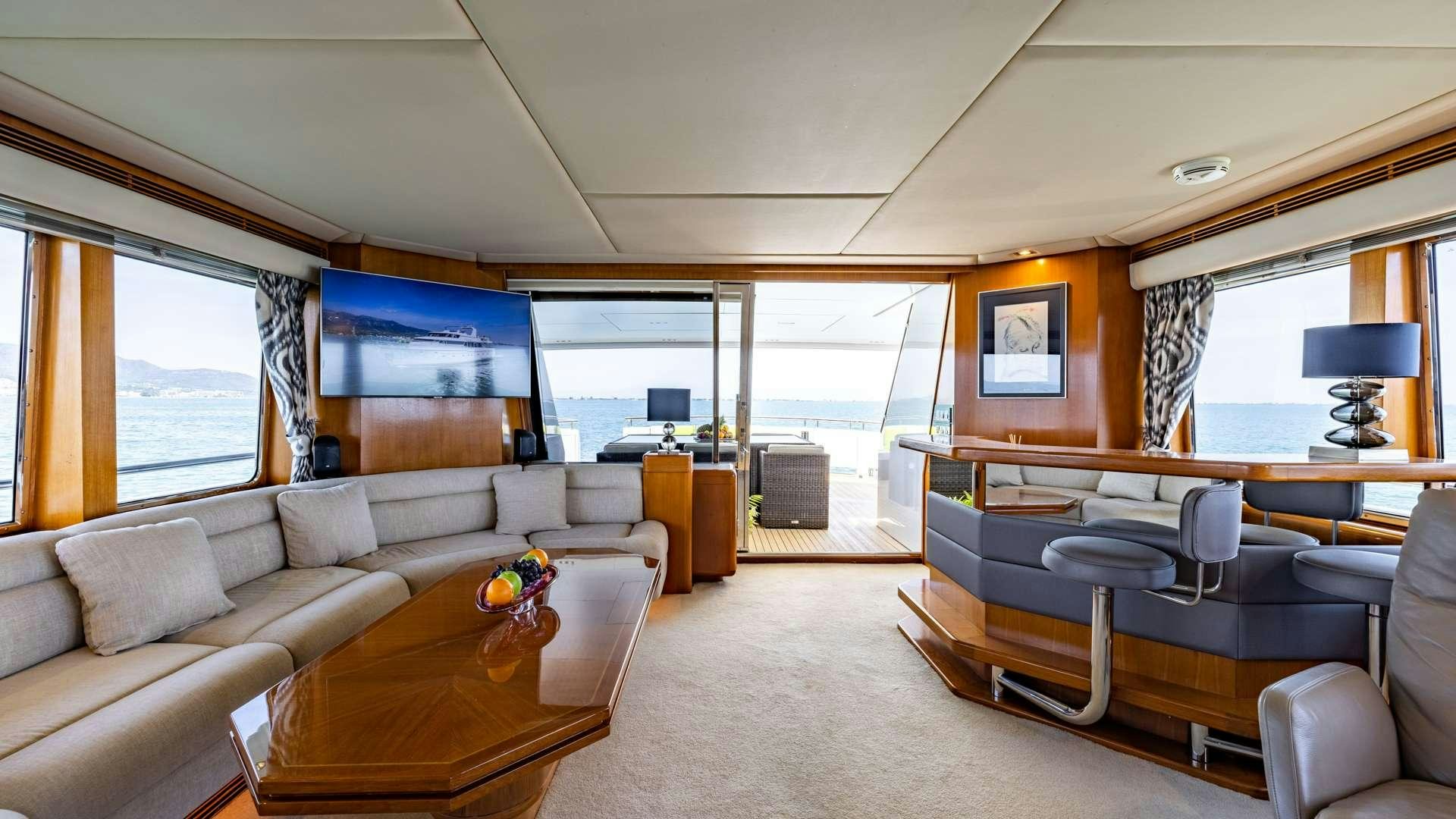 a living room with a large window aboard CAMENA II Yacht for Charter