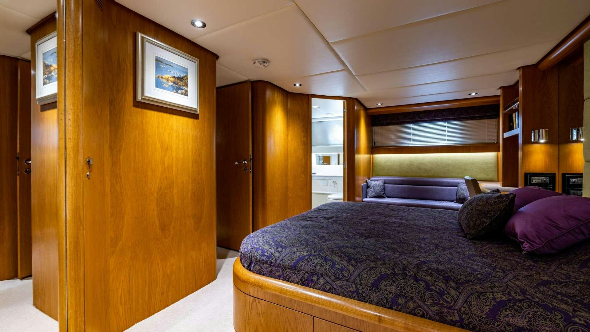a bed in a room aboard CAMENA II Yacht for Charter