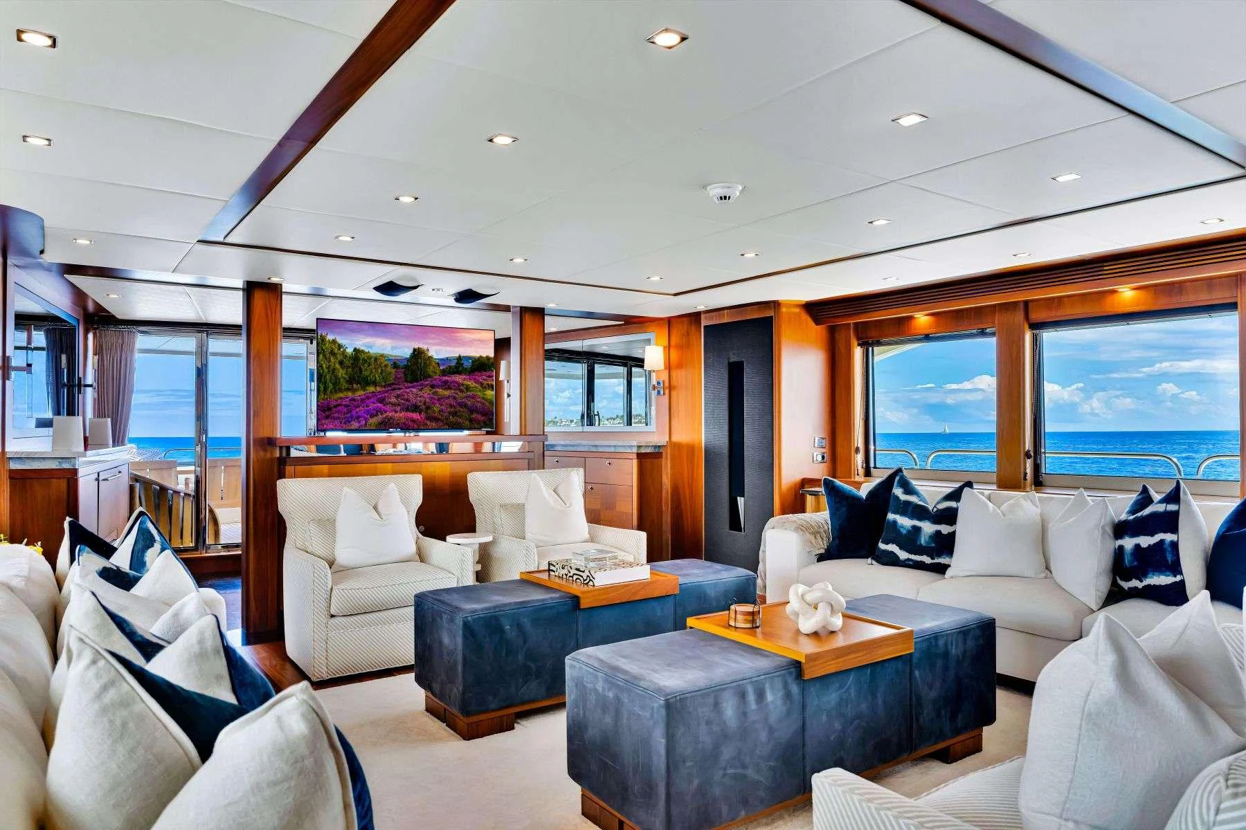 a living room with a large window aboard NATURAL 9 Yacht for Charter