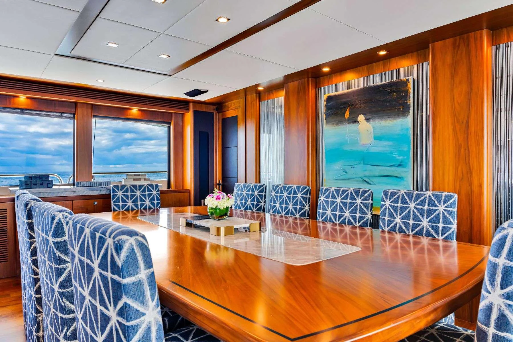 a large dining table in a room aboard NATURAL 9 Yacht for Charter