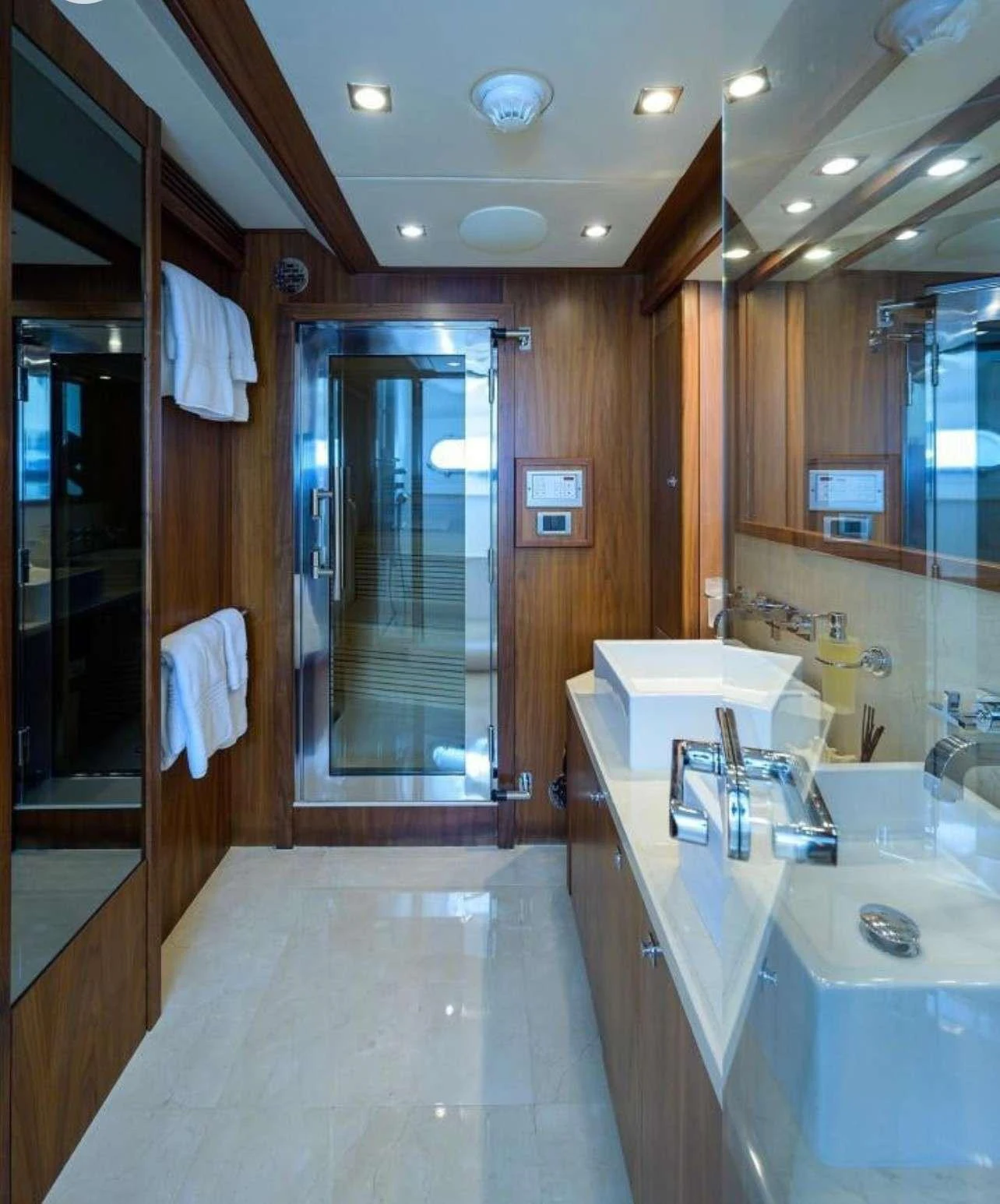 a bathroom with a large mirror aboard NATURAL 9 Yacht for Charter
